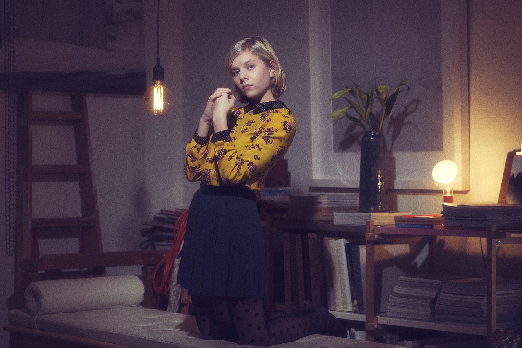 1800x1200 Wallpaper / sitting, home interior, chair, real people, illuminated, front view, candle, standing, beautiful woman, musician, 720P, Aurora Aksnes, lighting equipment free download