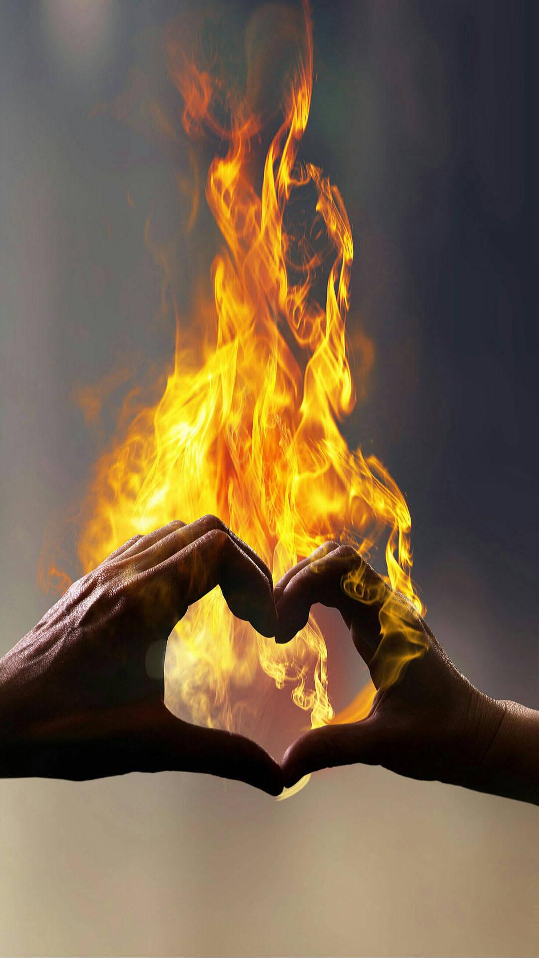 1080x1920 Download Finger Heart In Blazing Fire Wallpaper