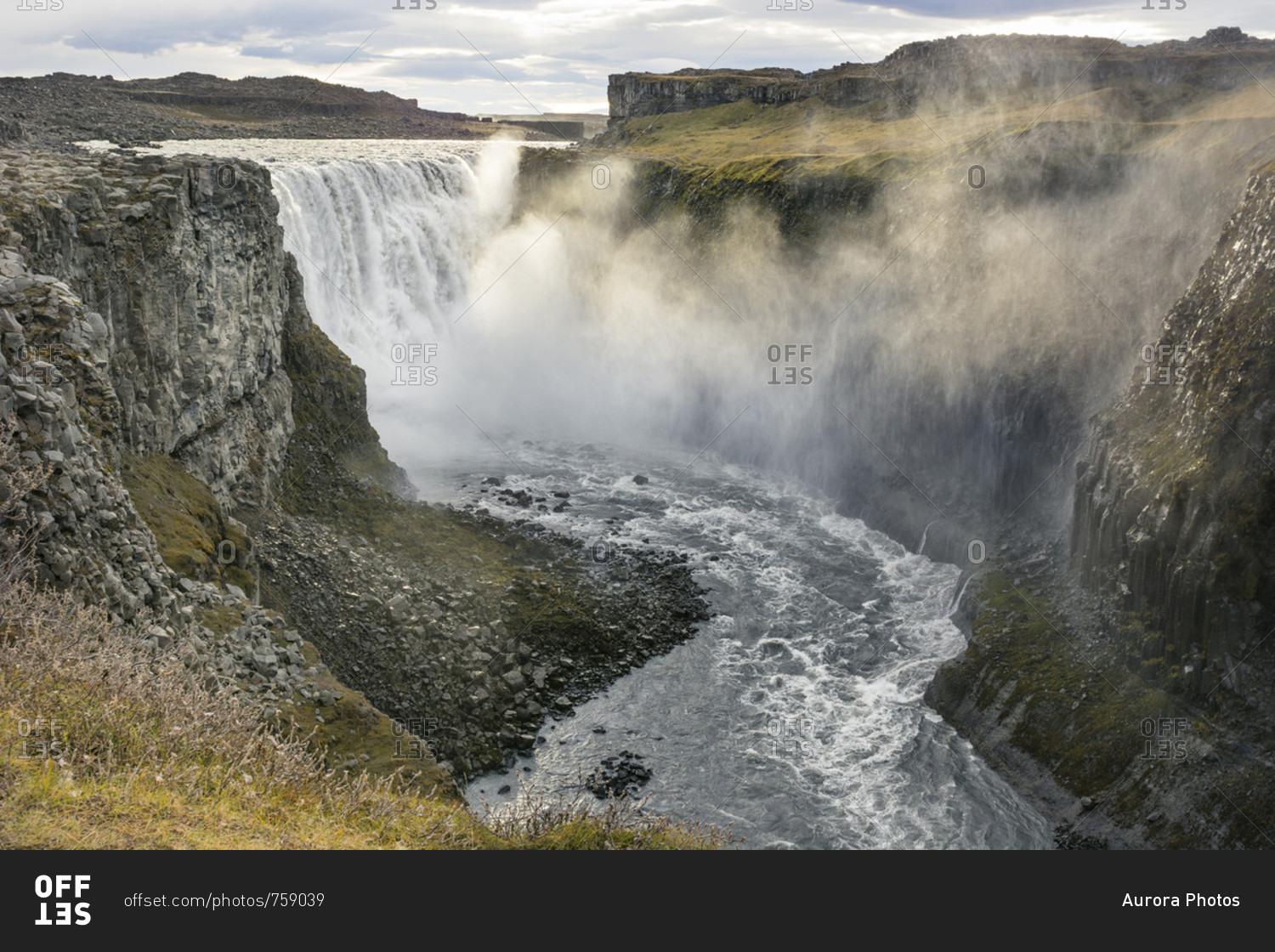 1500x1120 The evening sun colours the mist of Dettifoss waterfall golden as it sprays the canyon around it, in North Iceland