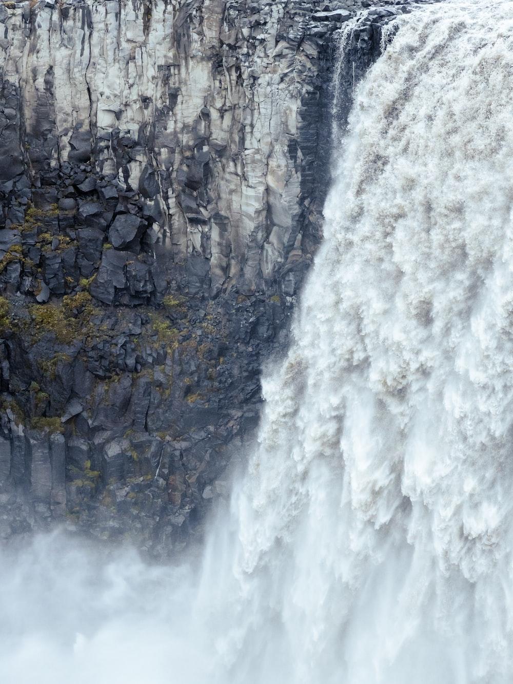 1000x1333 a waterfall with a large amount of water coming out of it photo