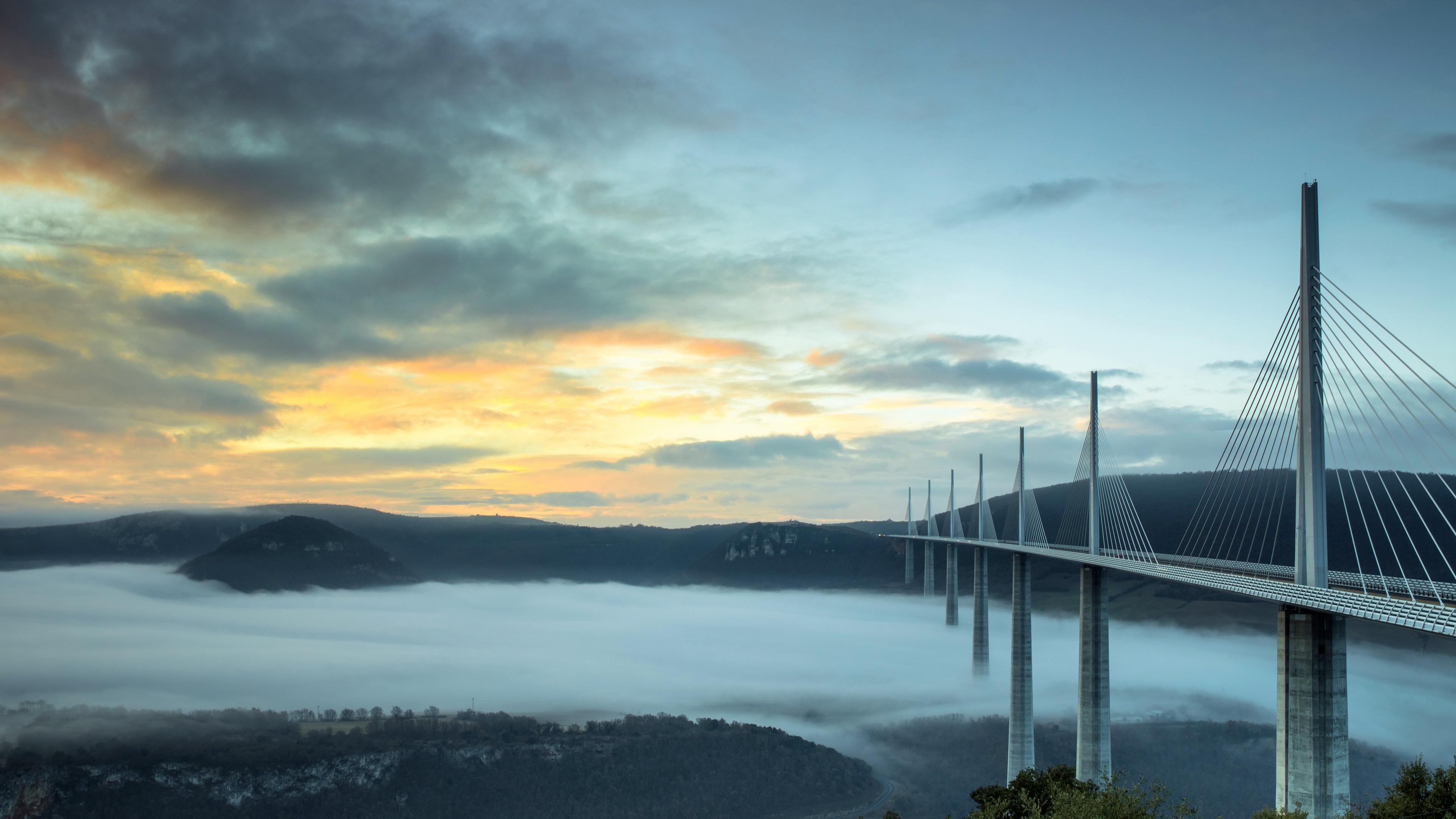 3840x2160 Outdoors Sky Landscape Bridge Construction Sunset Clouds Millau Viaduct Wallpaper:3840x2160