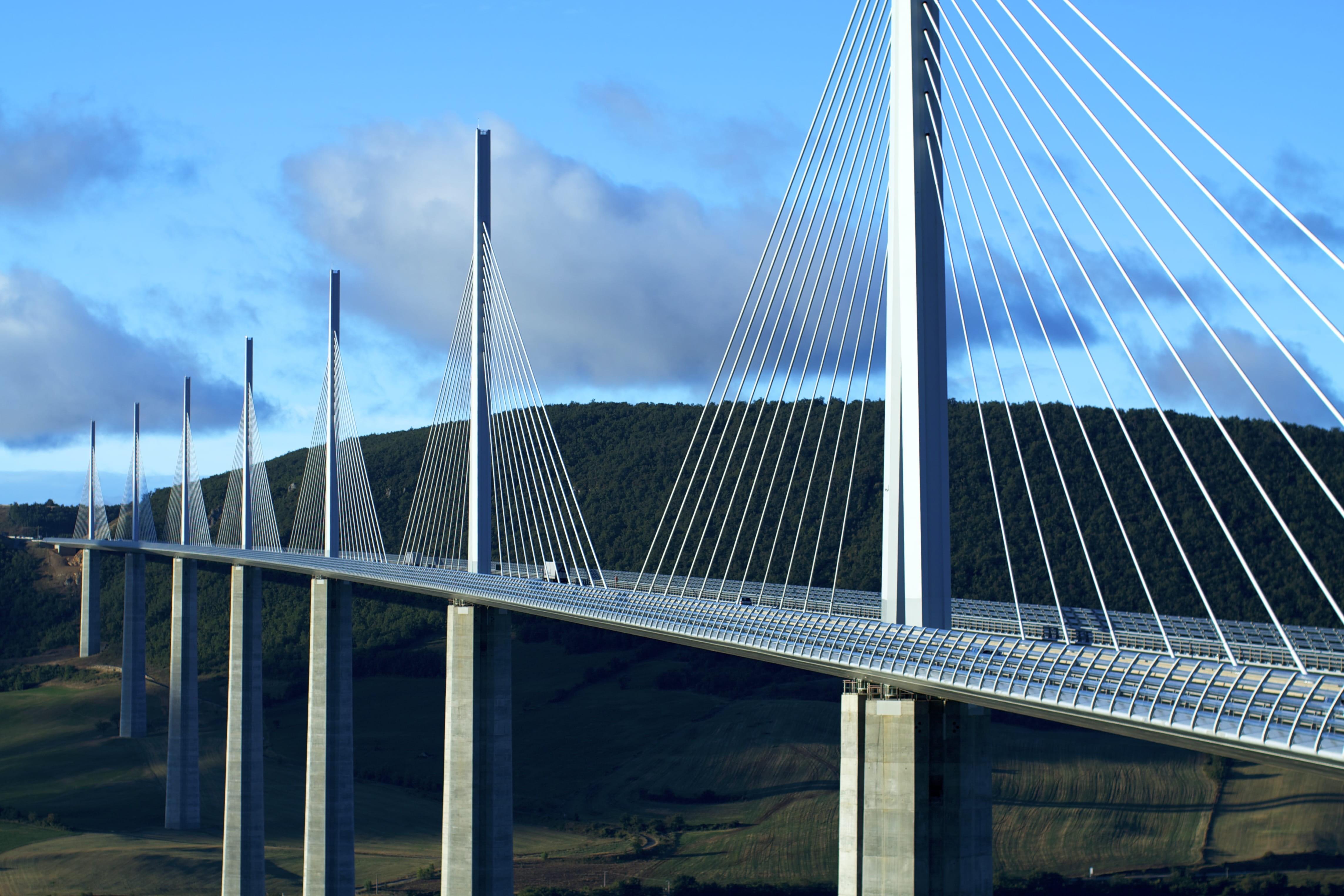 4575x3050 Wallpaper / sky, cloud, bridges, millau, france, low angle view, architecture, 4K, transportation, day, viaduc de millau, bridge, engineering, bridge made structure free download