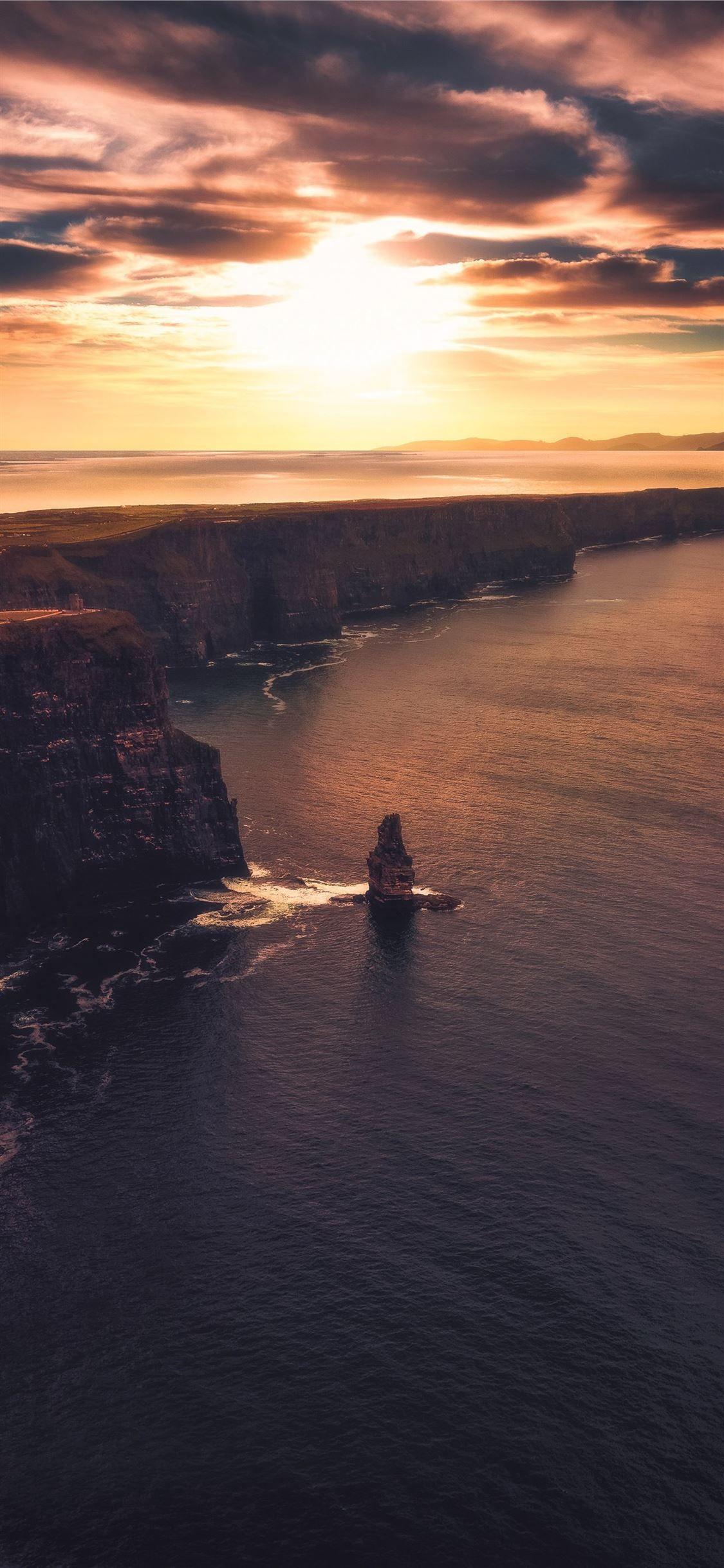 1125x2436 aerial view photography of cliff #nature #ocean #water #scenery #sky #iPhone11Wallpaper. Disney phone wallpaper, Water background, Aerial view