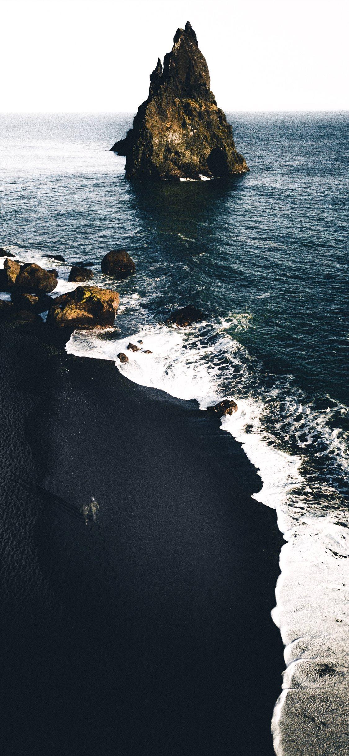 1125x2436 brown cliffs on ocean iPhone X Wallpaper Free Download