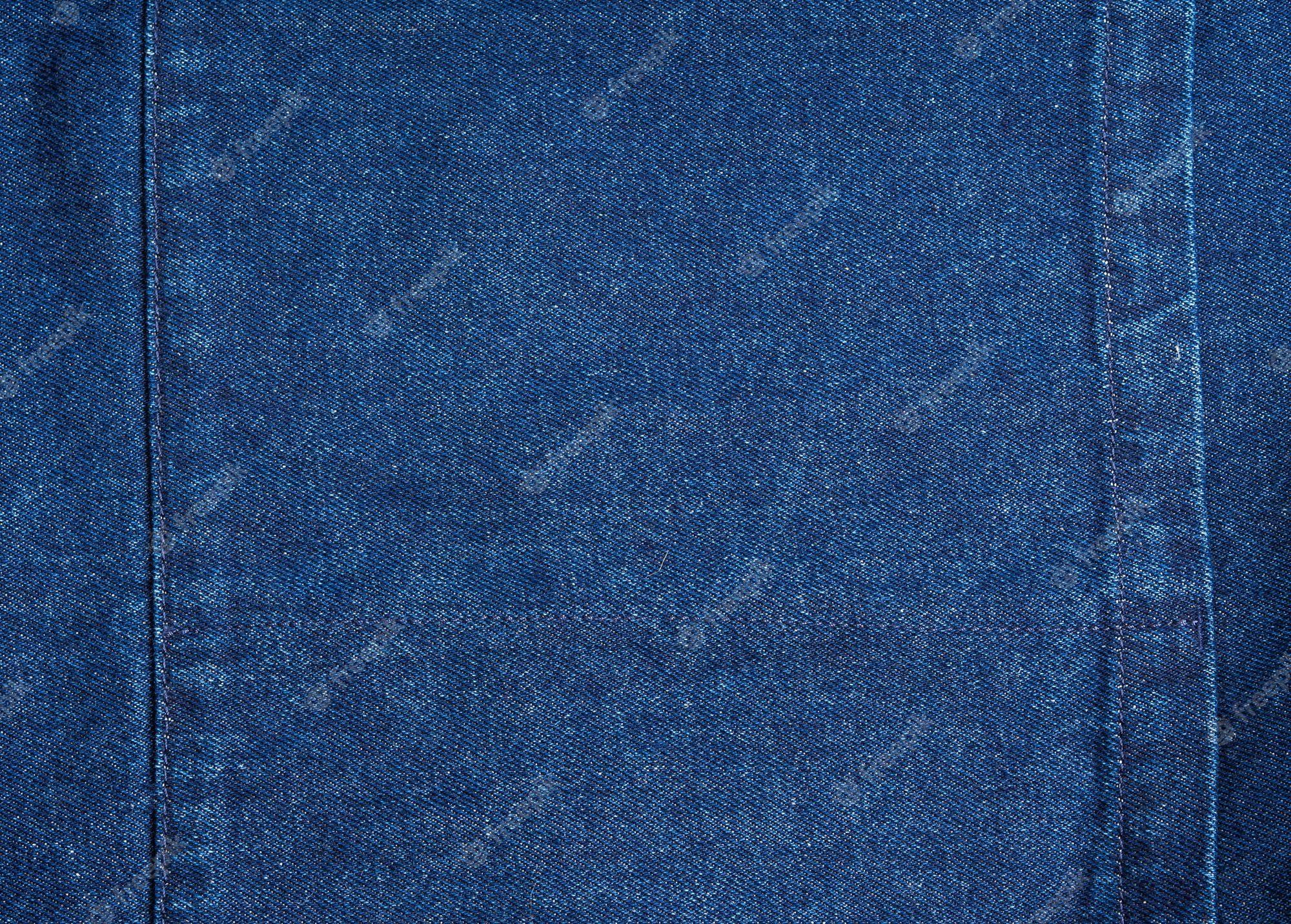 2000x1432 Premium Photo. Dark blue jeans denim texture fabric background