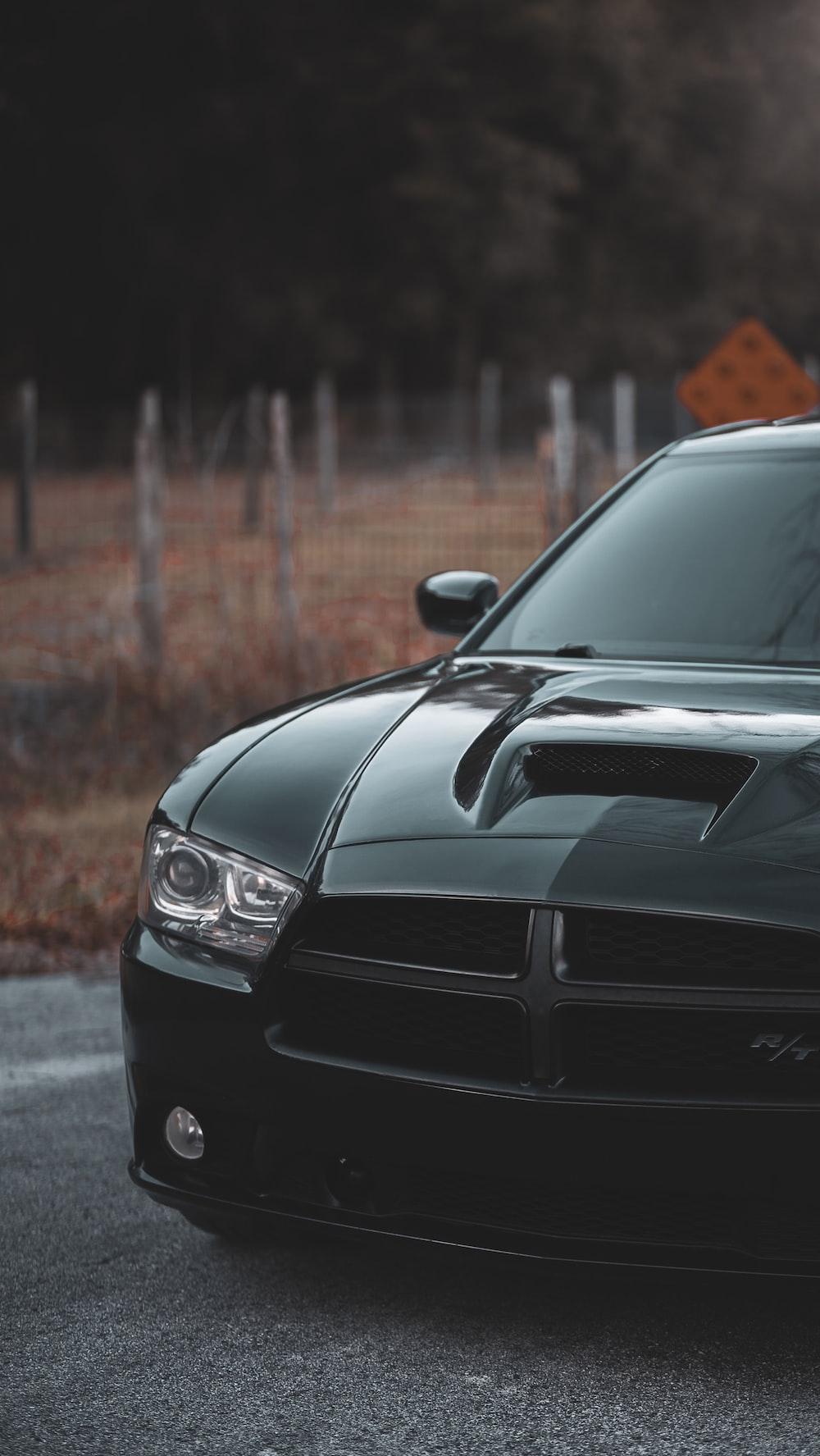 1000x1775 black Dodge Charger parked on parking space photo