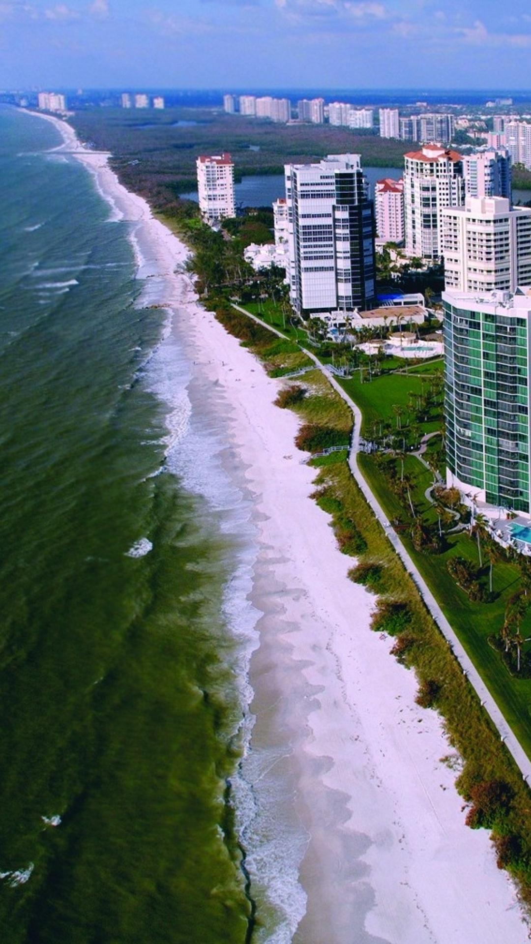 1080x1920 Ocean Buildings City Beach desktop PC and Mac wallpaper