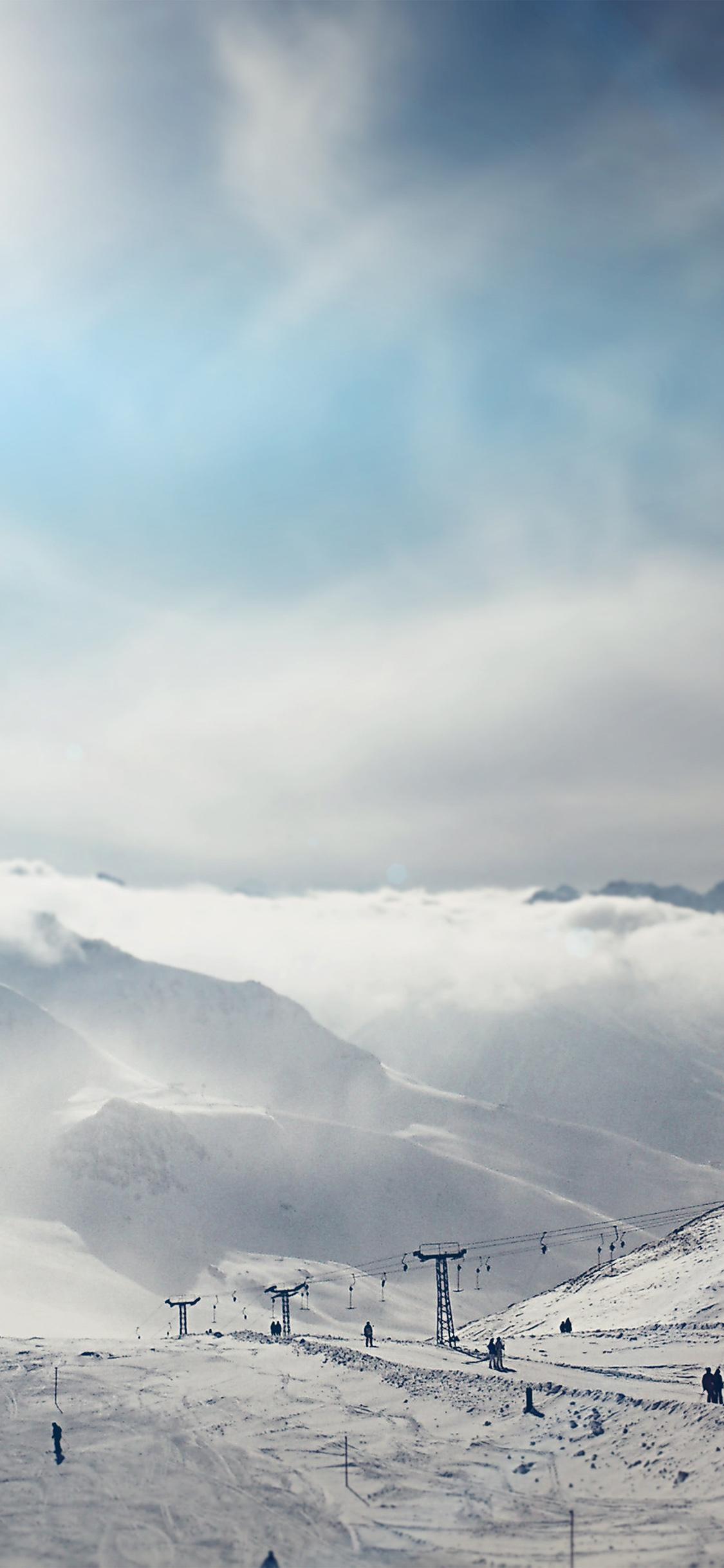 1125x2436 iPhone X wallpaper. snow ski winter play mountain sunny bokeh flare blue