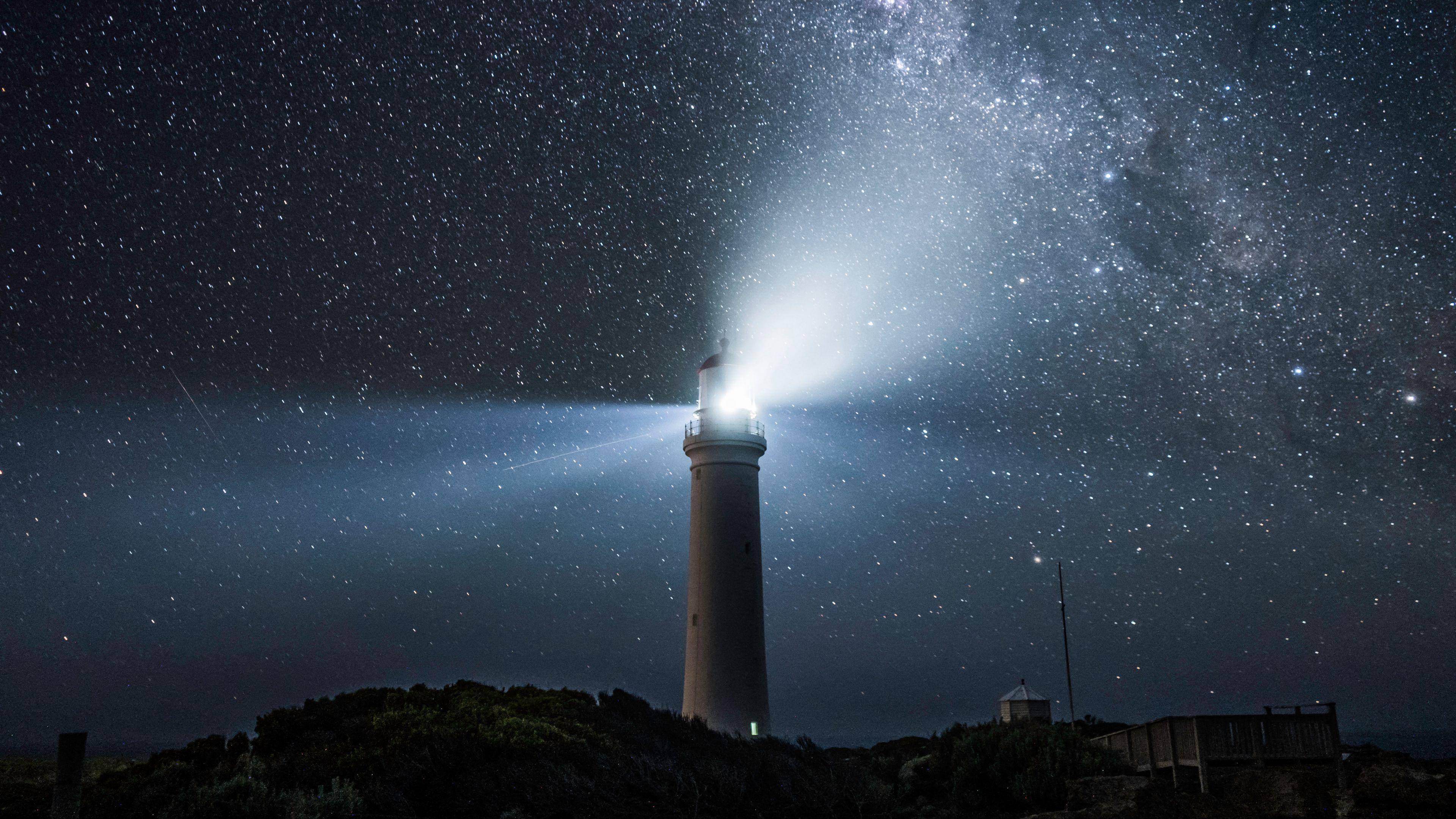 3840x2160 Download wallpaper 3840x2160 lighthouse, light, night, starry sky 4k uhd 16:9 HD background