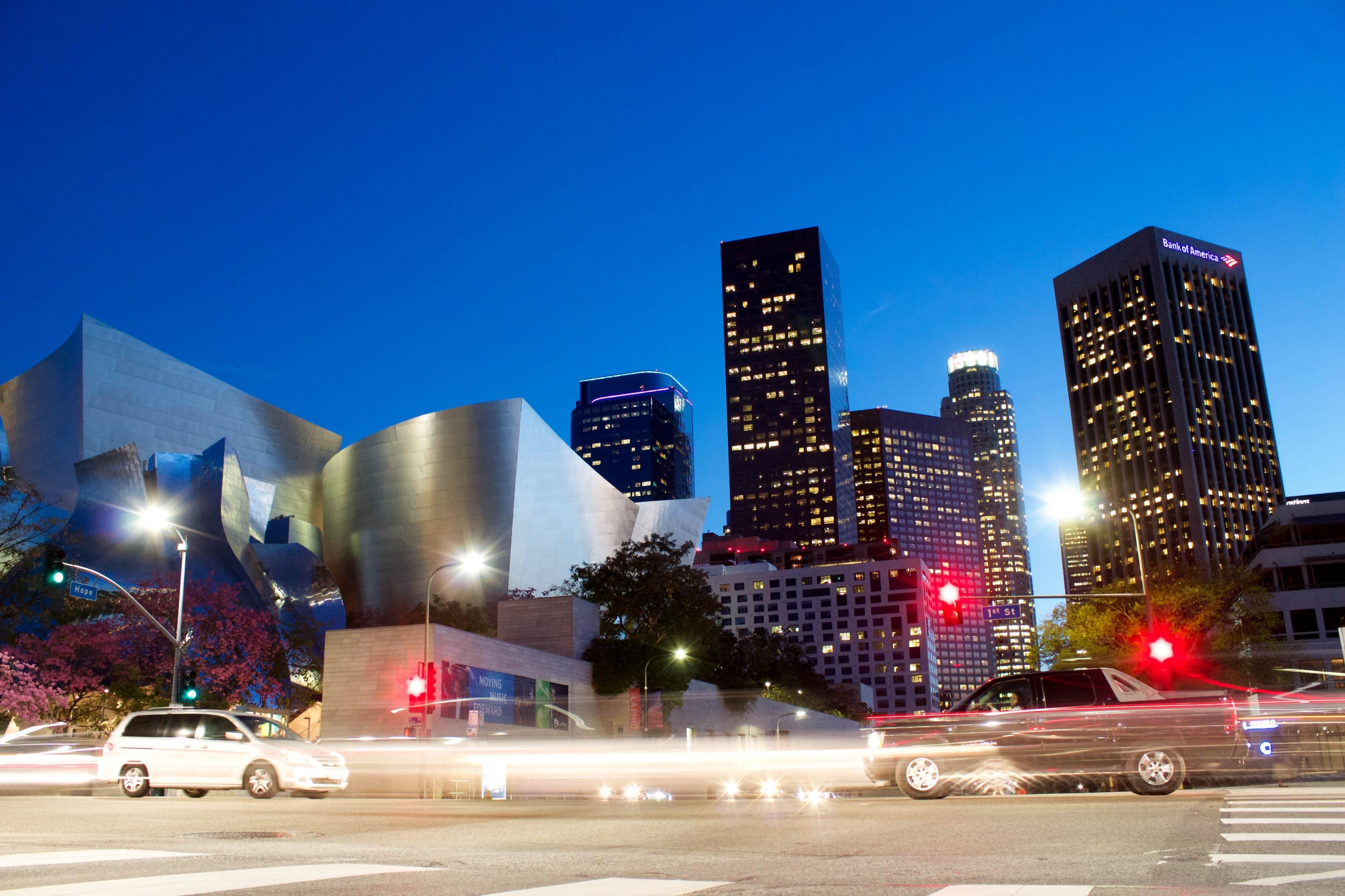 3840x2560 Wallpaper / a long exposure shot of cars in a street of los angeles with a modern silver building at the back, downtown los angeles at night 4k wallpaper free download
