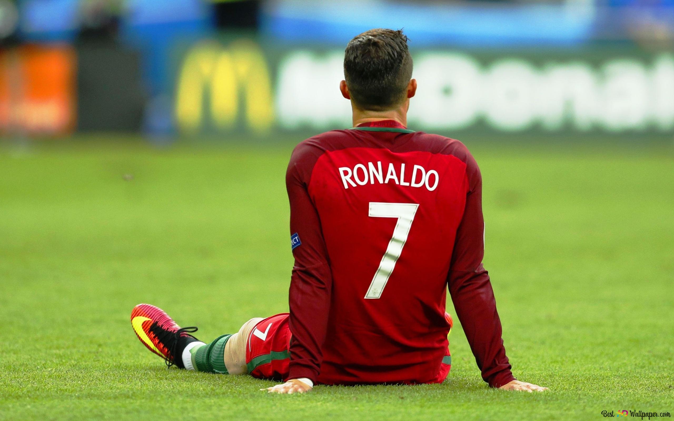2560x1600 Cristiano Ronaldo, The World Renowned Football Player Of The Portuguese National Team, Is Sitting In The Stadium With Her Number 7 Shirt. 2K Wallpaper Download