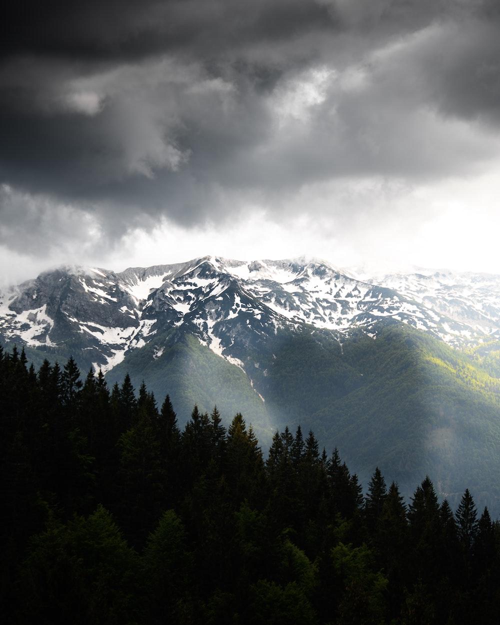 1000x1250 birds eye view of mountains and cloudy sky photo