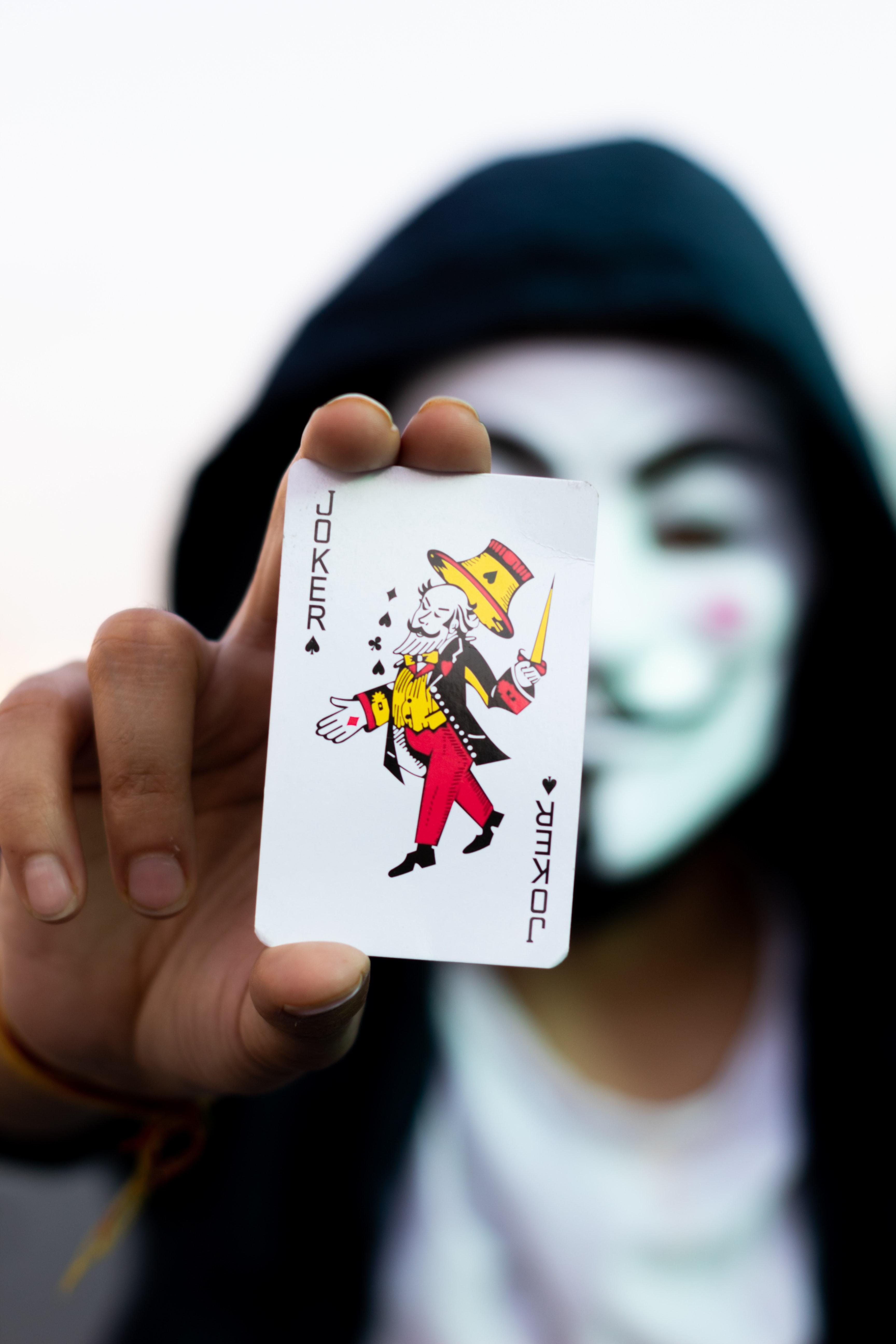 3456x5184 Person Holding Joker Card · Free