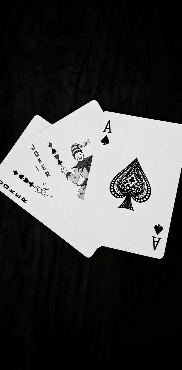 630x1280 Download Black And White Joker Stack Of Card Wallpaper