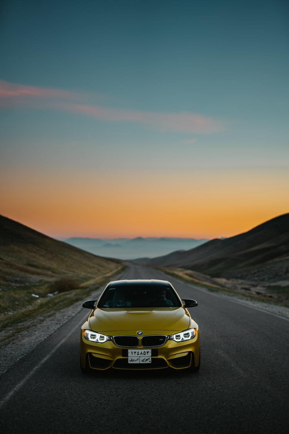 1000x1499 Yellow bmw car on road photo