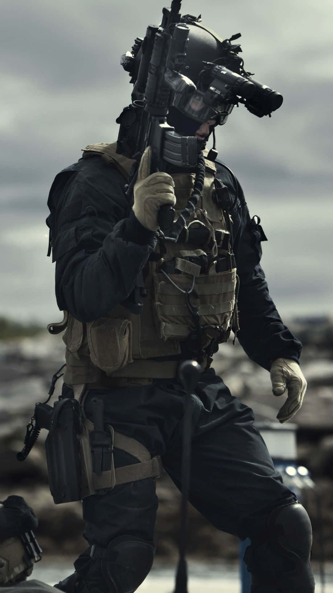 1080x1920 Download A Soldier In A Military Uniform Is Holding A Gun