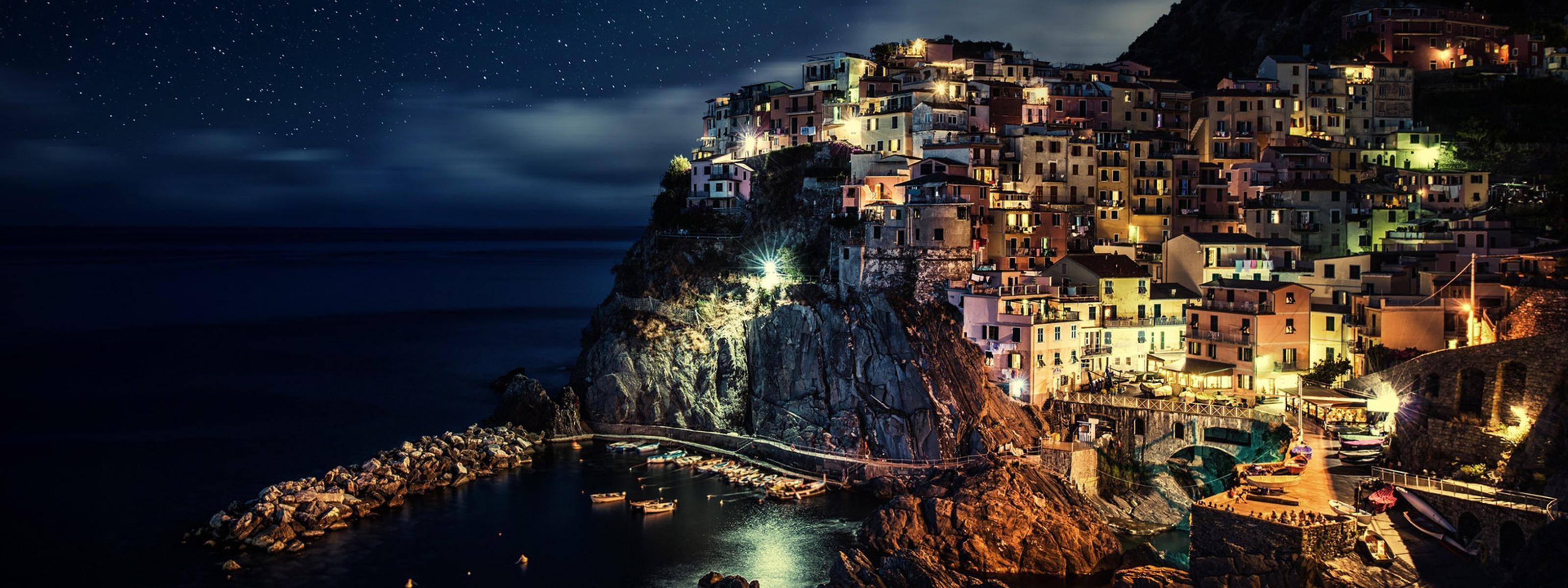 3200x1200 Night in romantic city from Italy on the coast