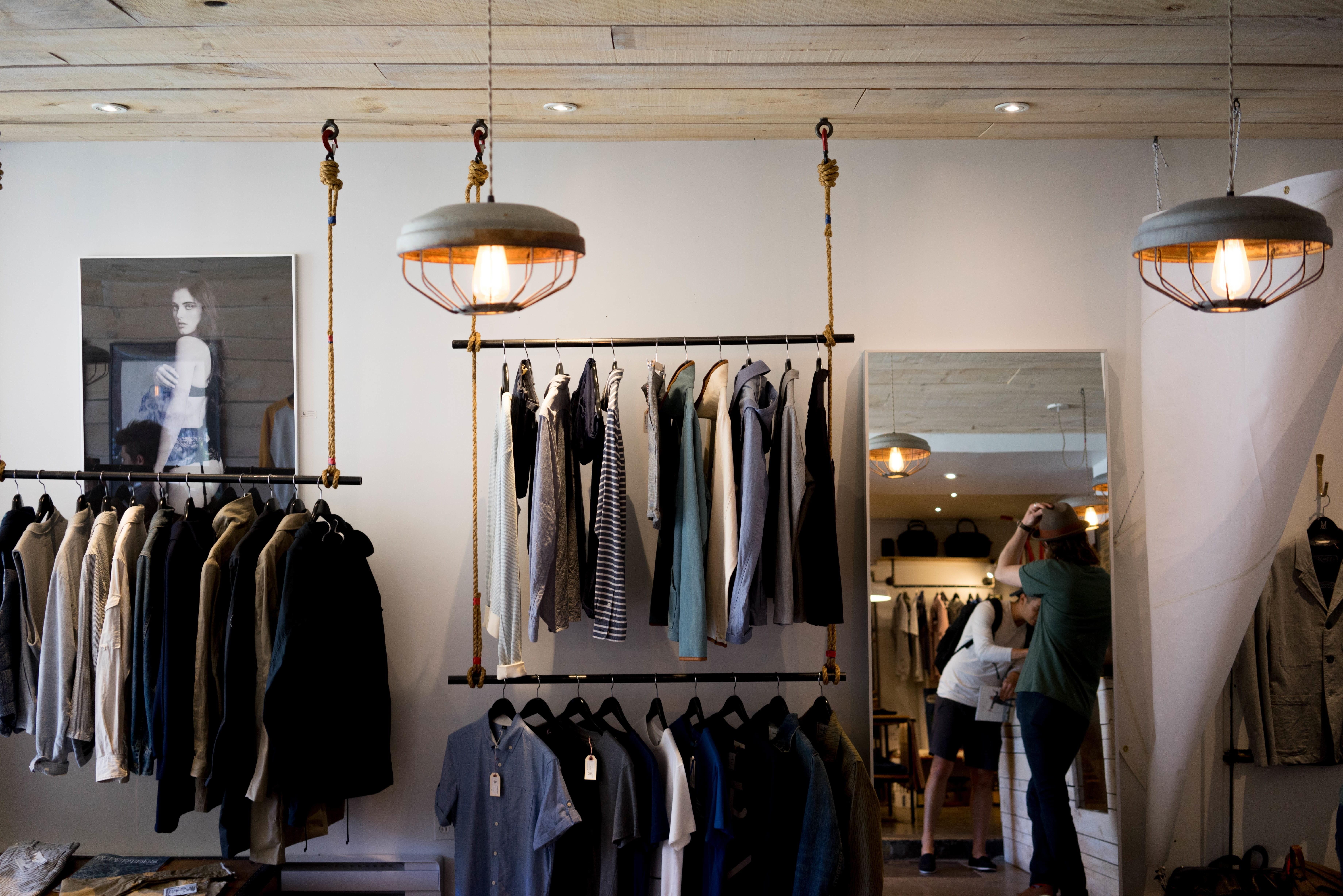 7360x4912 Wallpaper / boutique, wardrobe, electric lamp, lot, commerce, real people, clothing, women, lighting equipment, clothing store, 5K, shopping, casual clothing, hanging free download