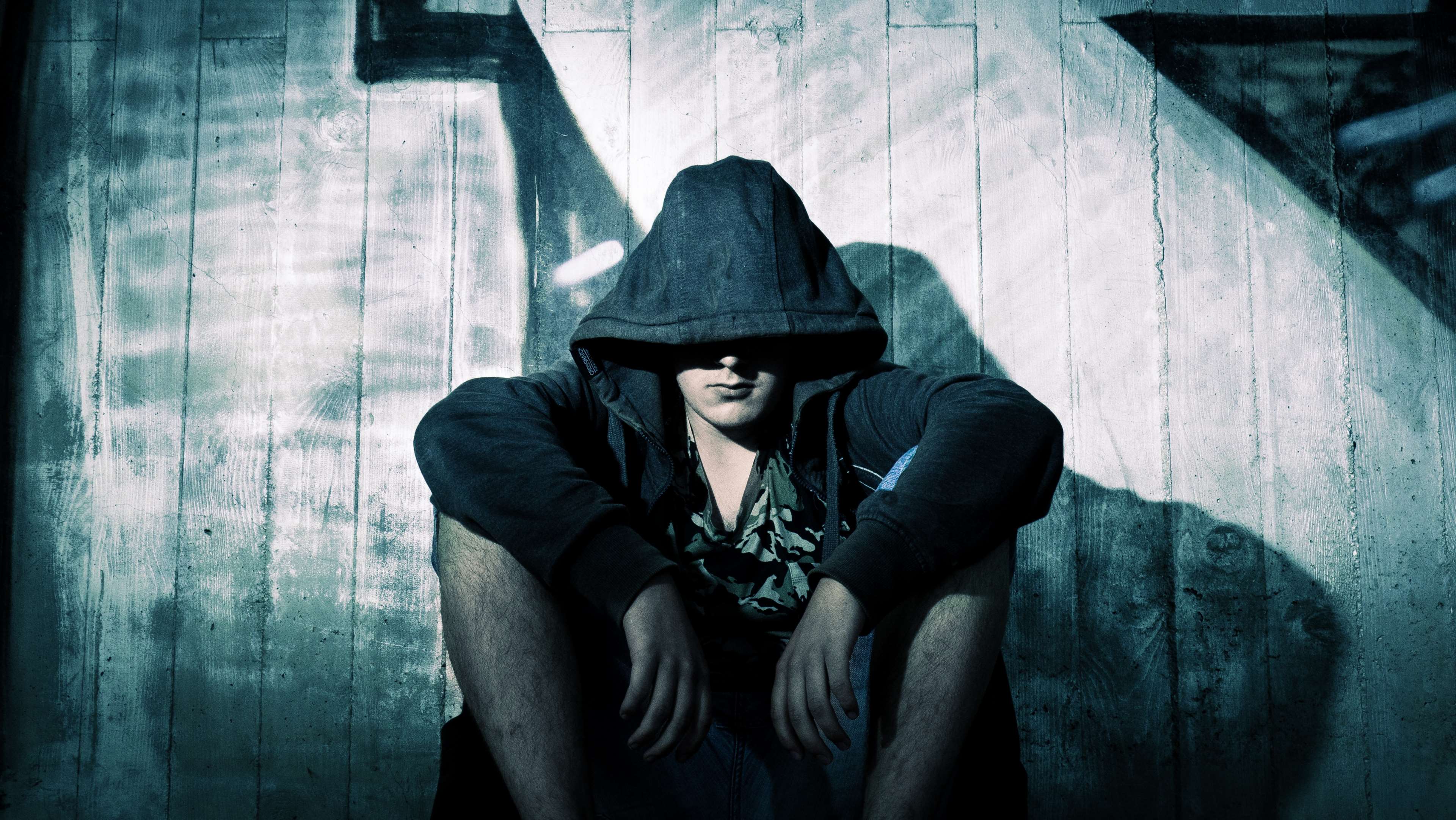 3840x2161 adult, alone, clothes, dark, despair, fashion, hoodie, jacket, man, mask, model, mood, mysterious, portrait, sadness, scene, shadow, sitting, spooky, street, stress, style, urban, wear, weird, wooden 4k wallpaper