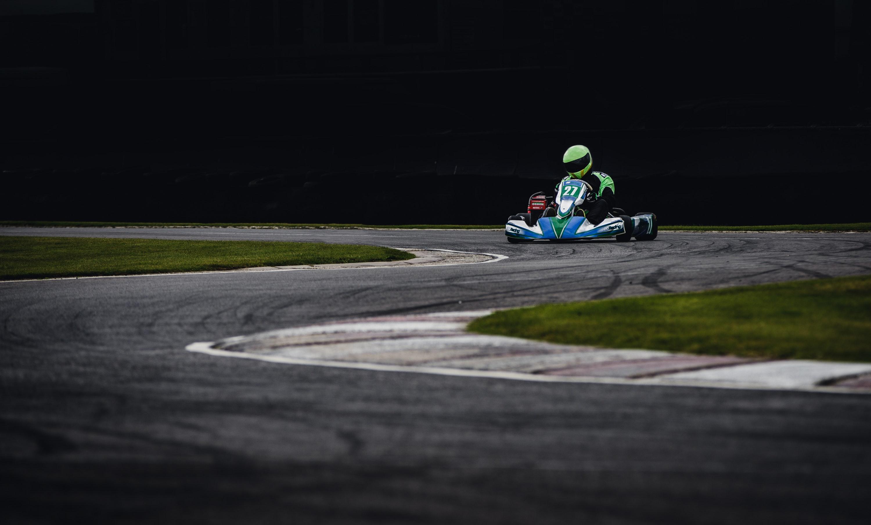 3000x1809 Man Wearing Green Helmet Riding Go Kart · Free