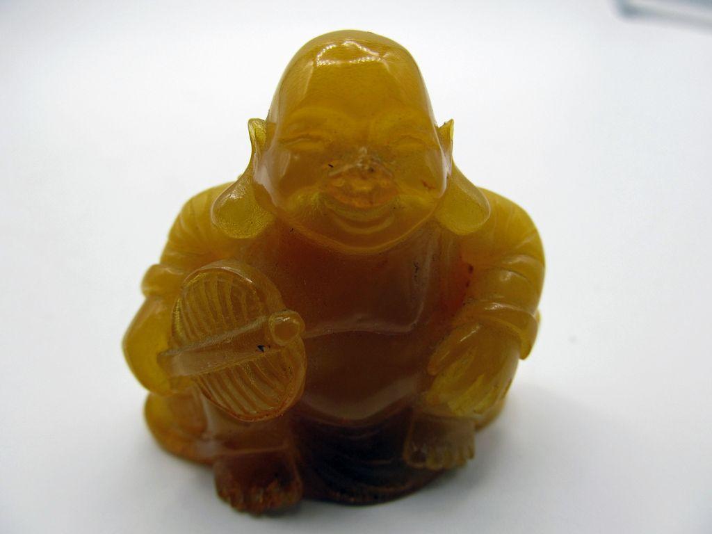 1024x768 Geoclassics. Baltic Amber Happy Buddha