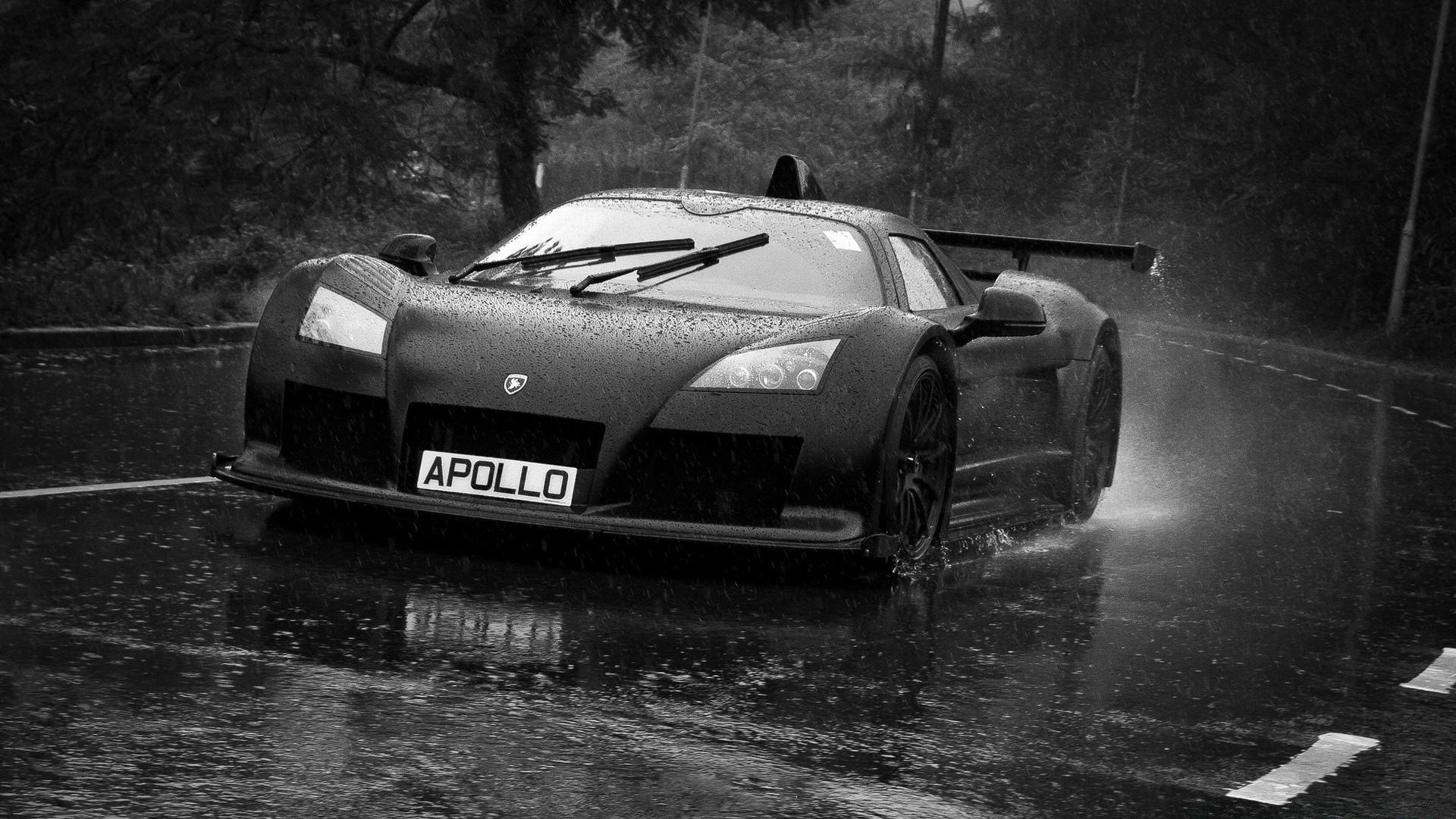 1920x1080 A black car rushes down the road in the rain wallpaper