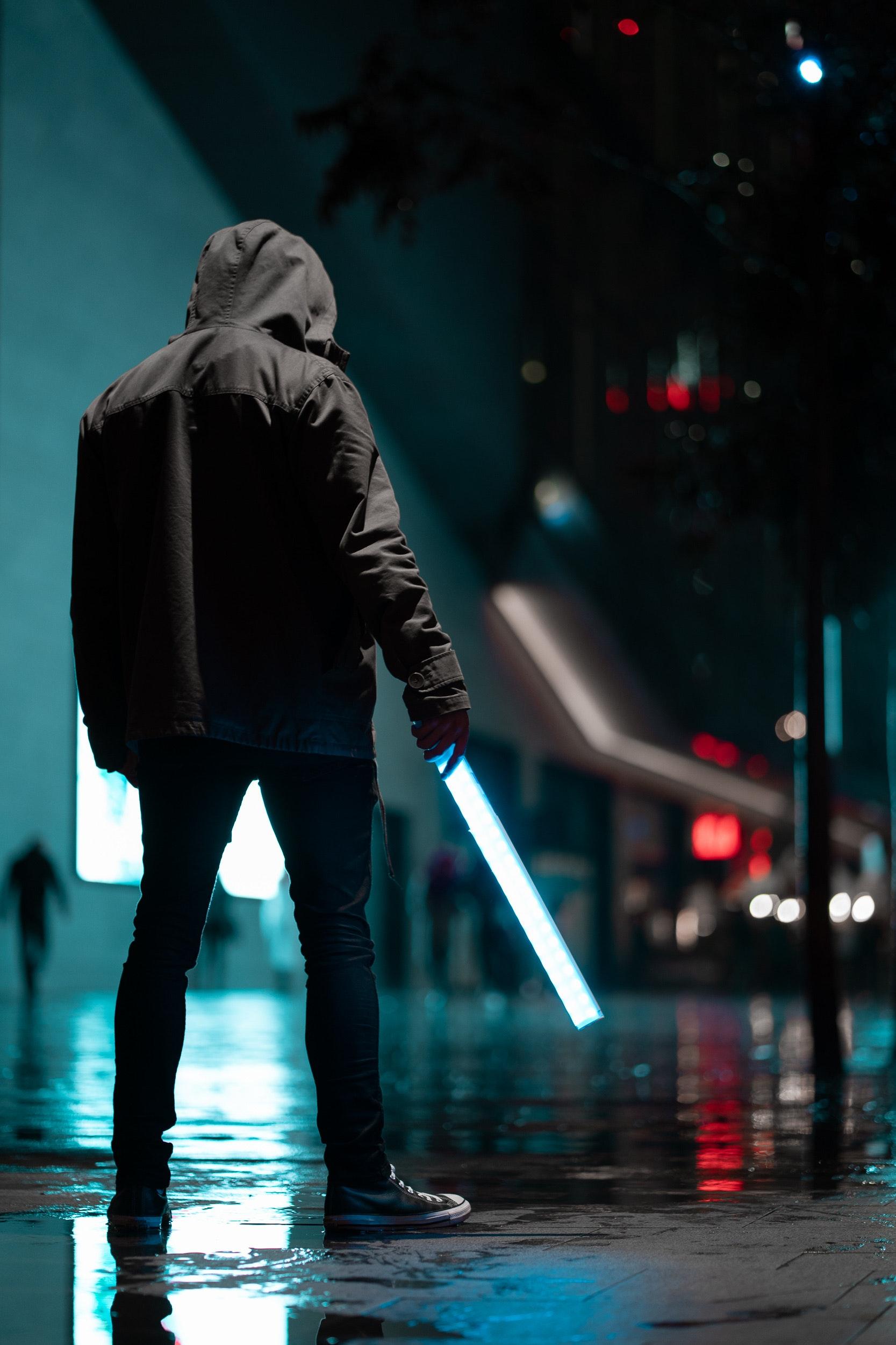 1667x2500 Man Wearing Black Hoodie Standing on Concrete Pavement at Night · Free