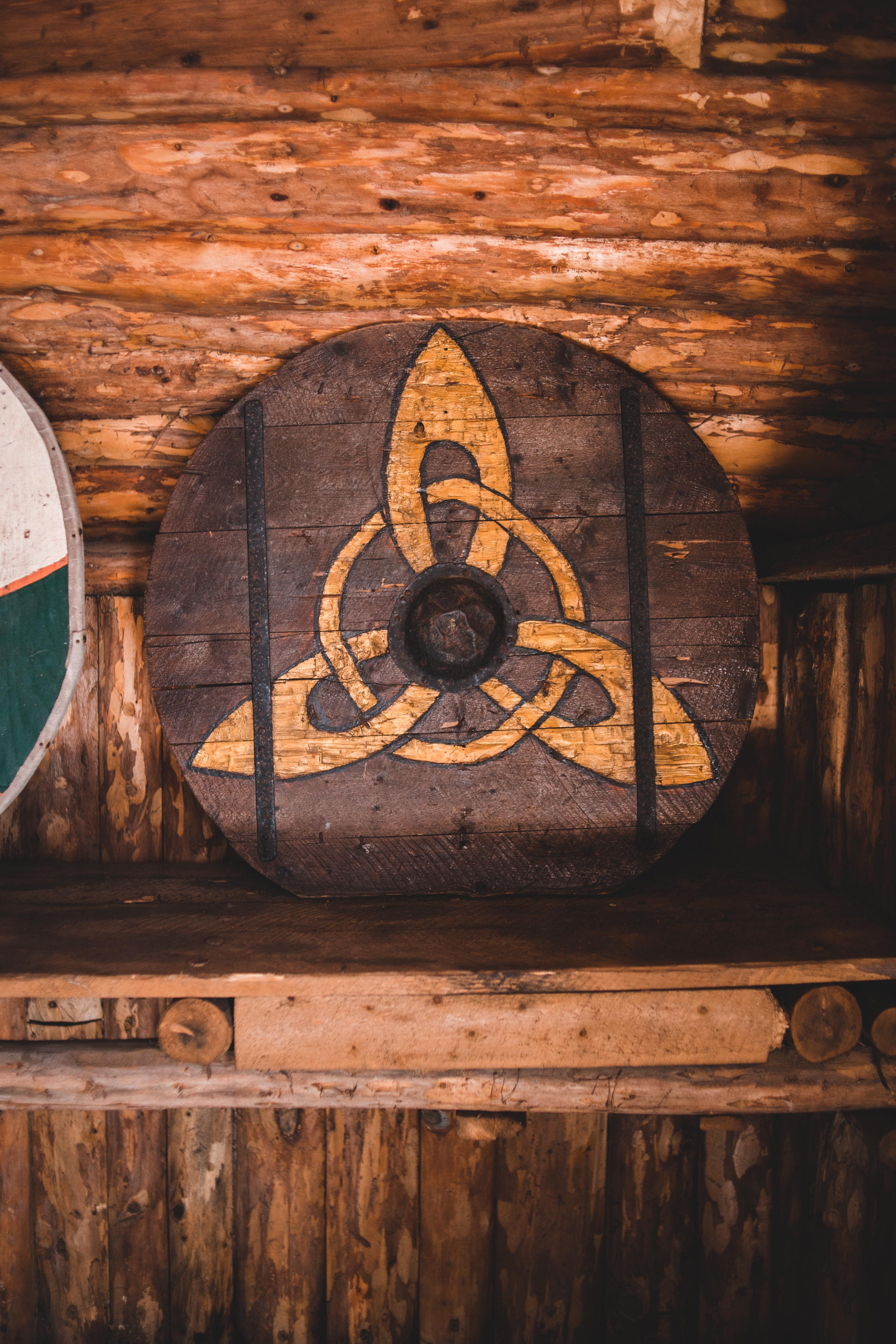 3648x5472 Circular wooden Viking shield on timber shelf · Free