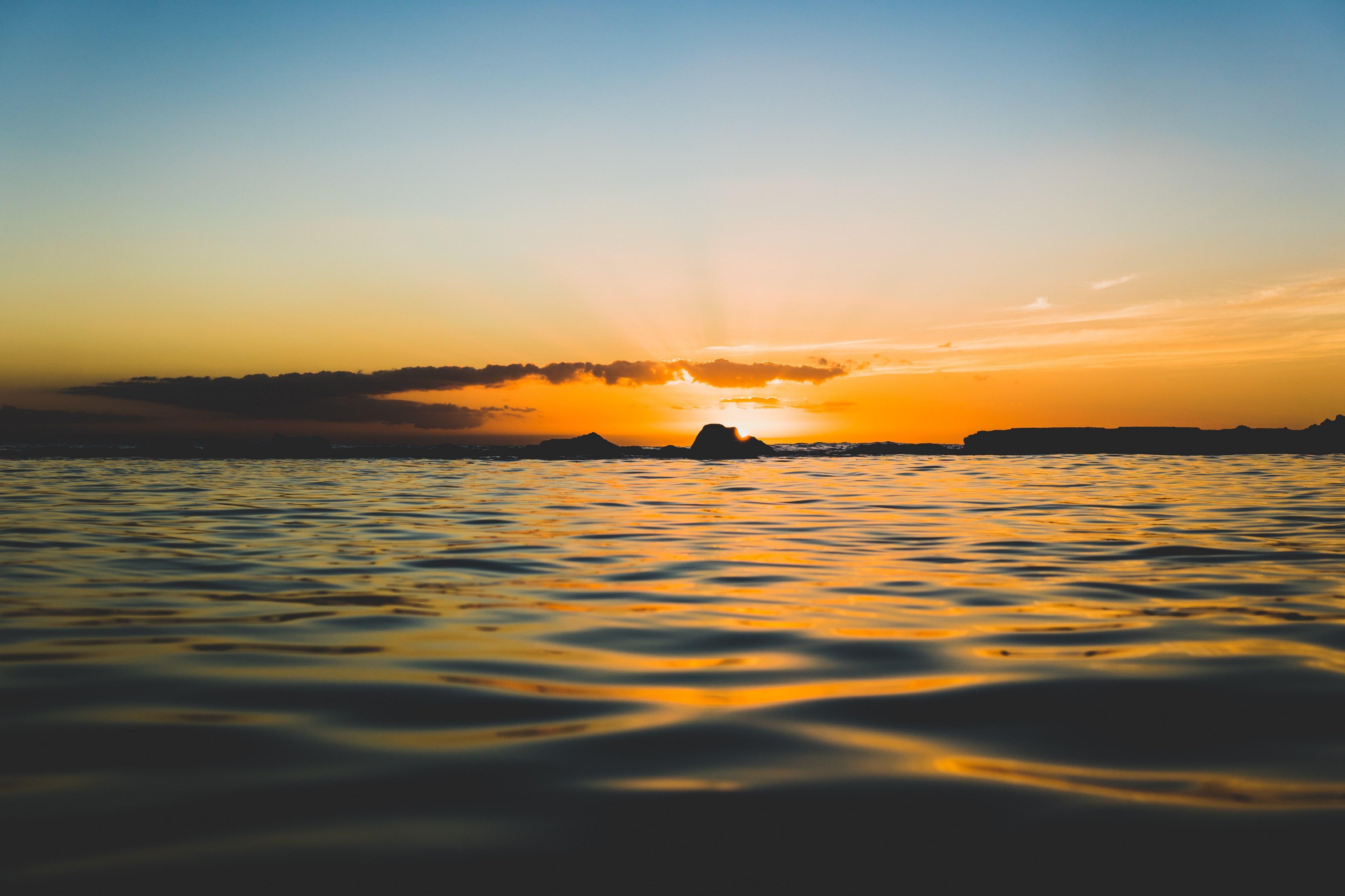 3840x2560 Wallpaper / an orange and blue sky over the ocean during a sunset, hawaiian sunset 4k wallpaper free download