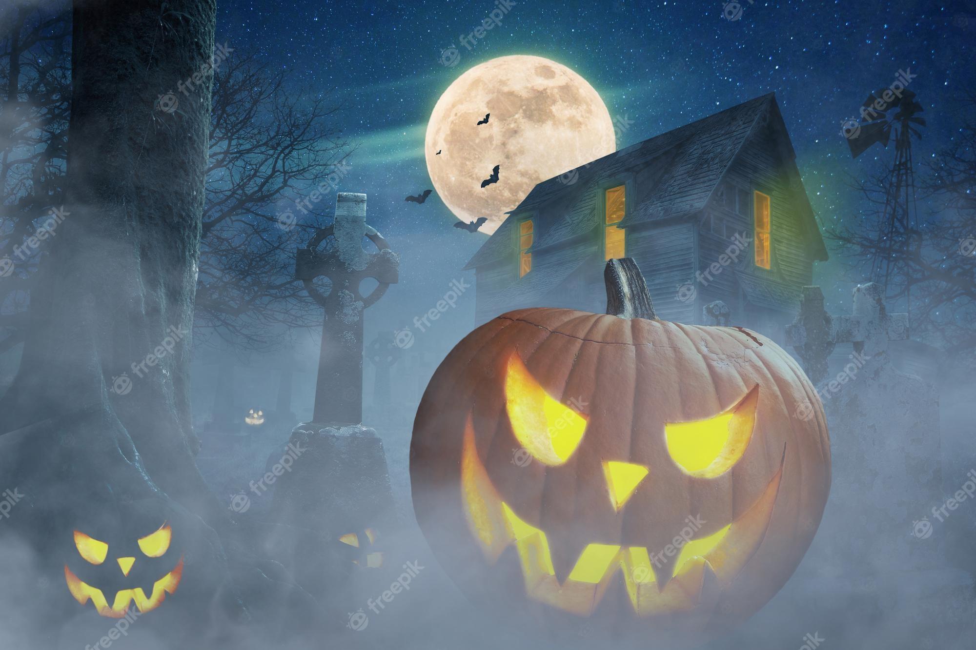 2000x1333 Premium Photo. Halloween wallpaper abandoned scary house near the cemetery in the forest with pumpkins a full moon bats and fog pumpkins in graveyard in the spooky night