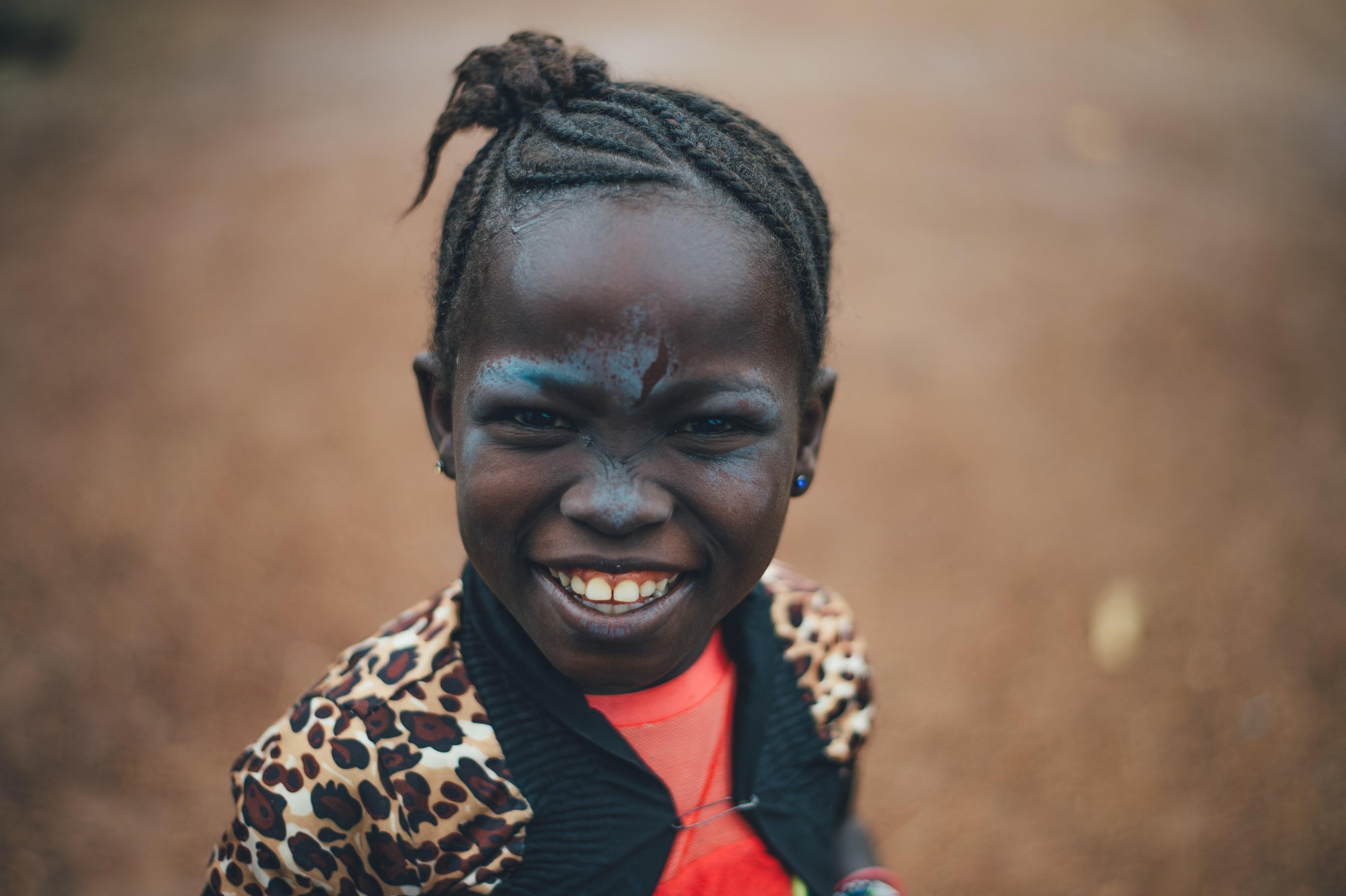 3840x2556 Wallpaper / happy young girl with braid and a cheetah jacket smiles widely, happy child 4k wallpaper free download