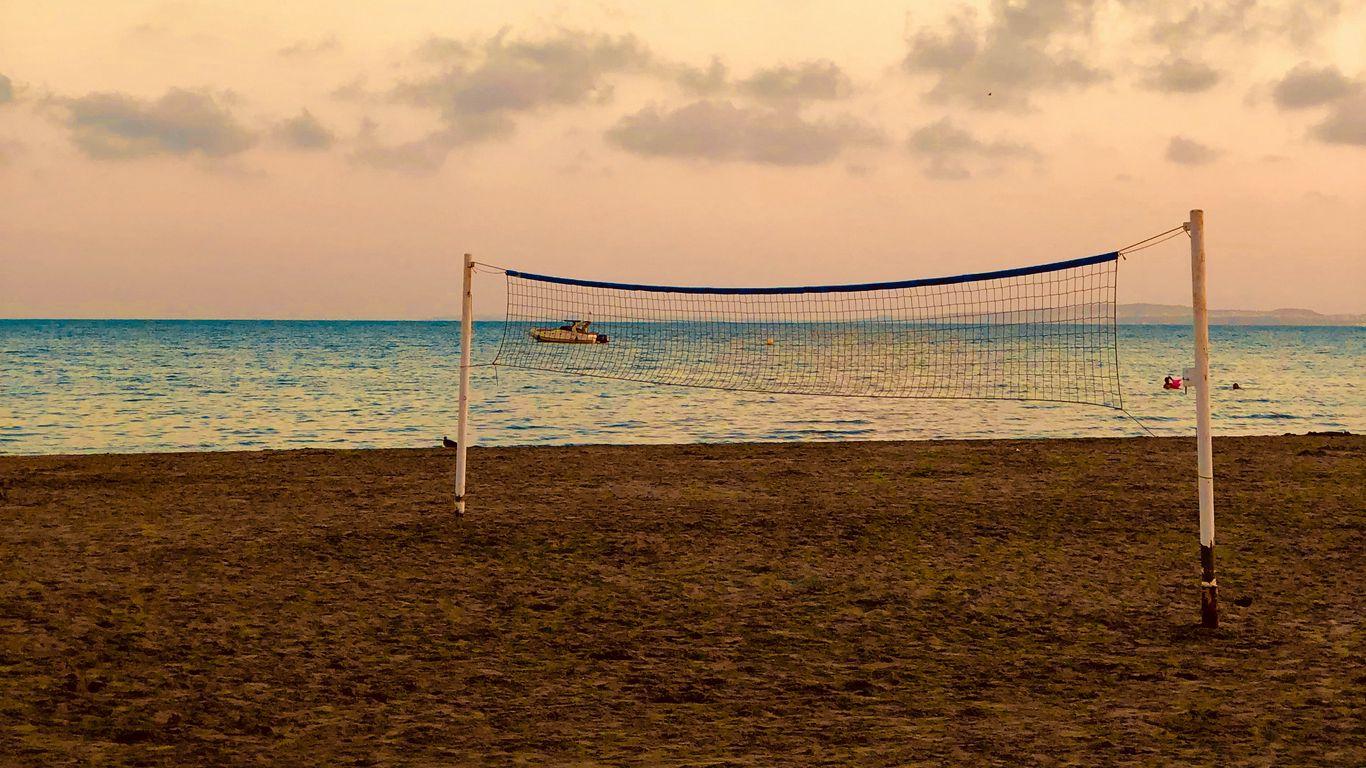 1366x768 Download wallpaper 1366x768 beach, volleyball, volleyball net, sea, horizon tablet, laptop HD background