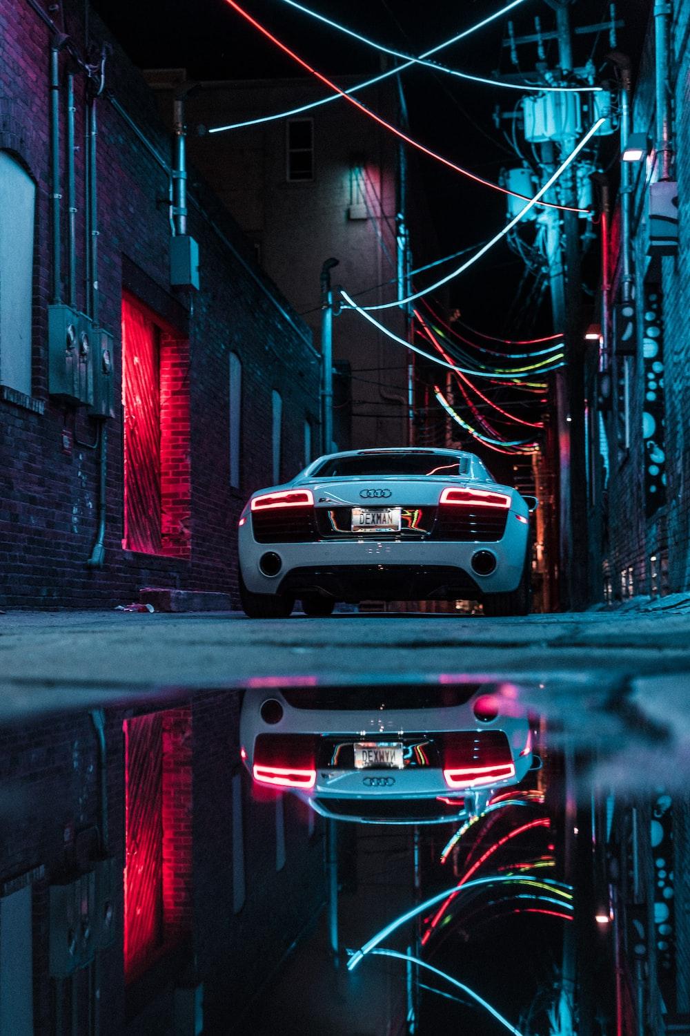 1000x1500 White car parked beside building photo