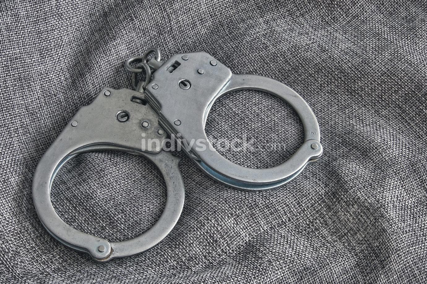 1380x920 Handcuffs on a dark background. The concept of justice. Abstract Wallpaper. Poster design
