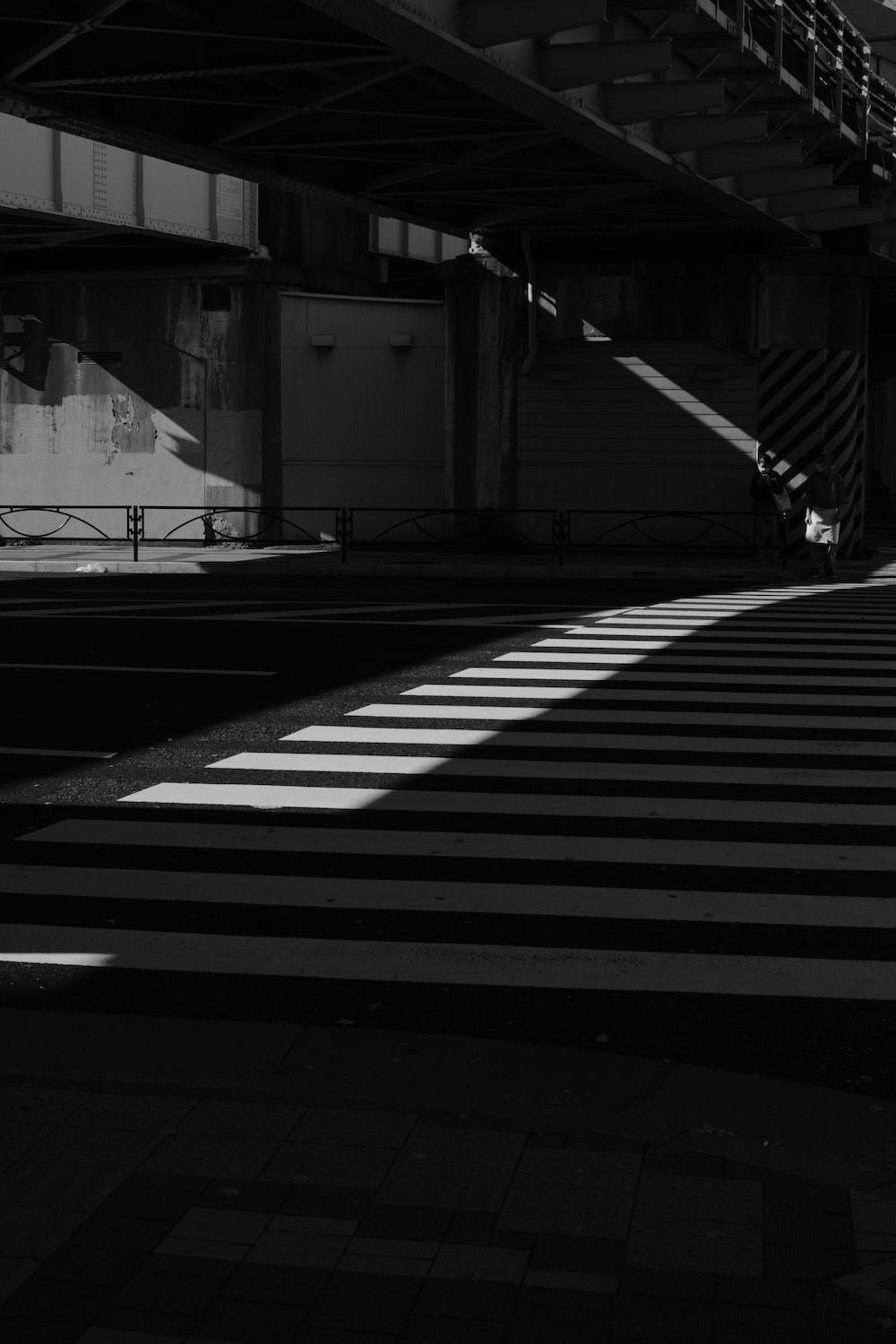 1000x1500 a black and white photo of a crosswalk photo