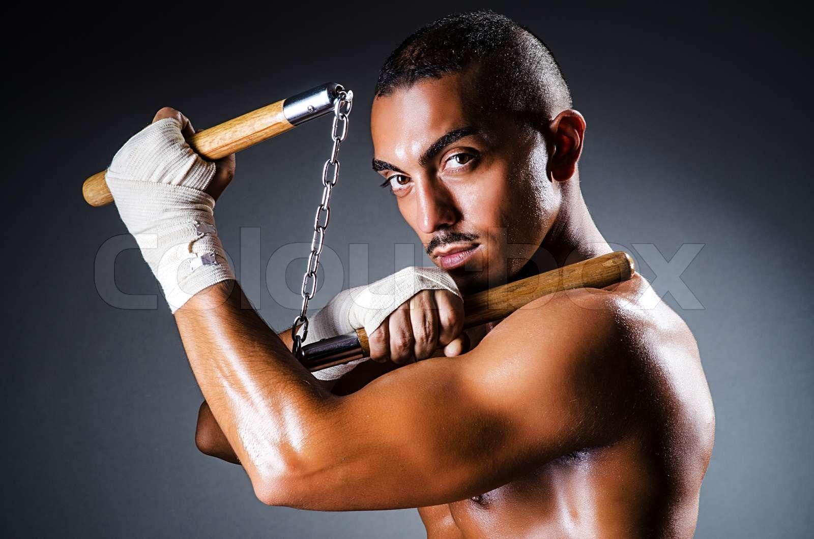 1600x1060 Strong man with nunchaku