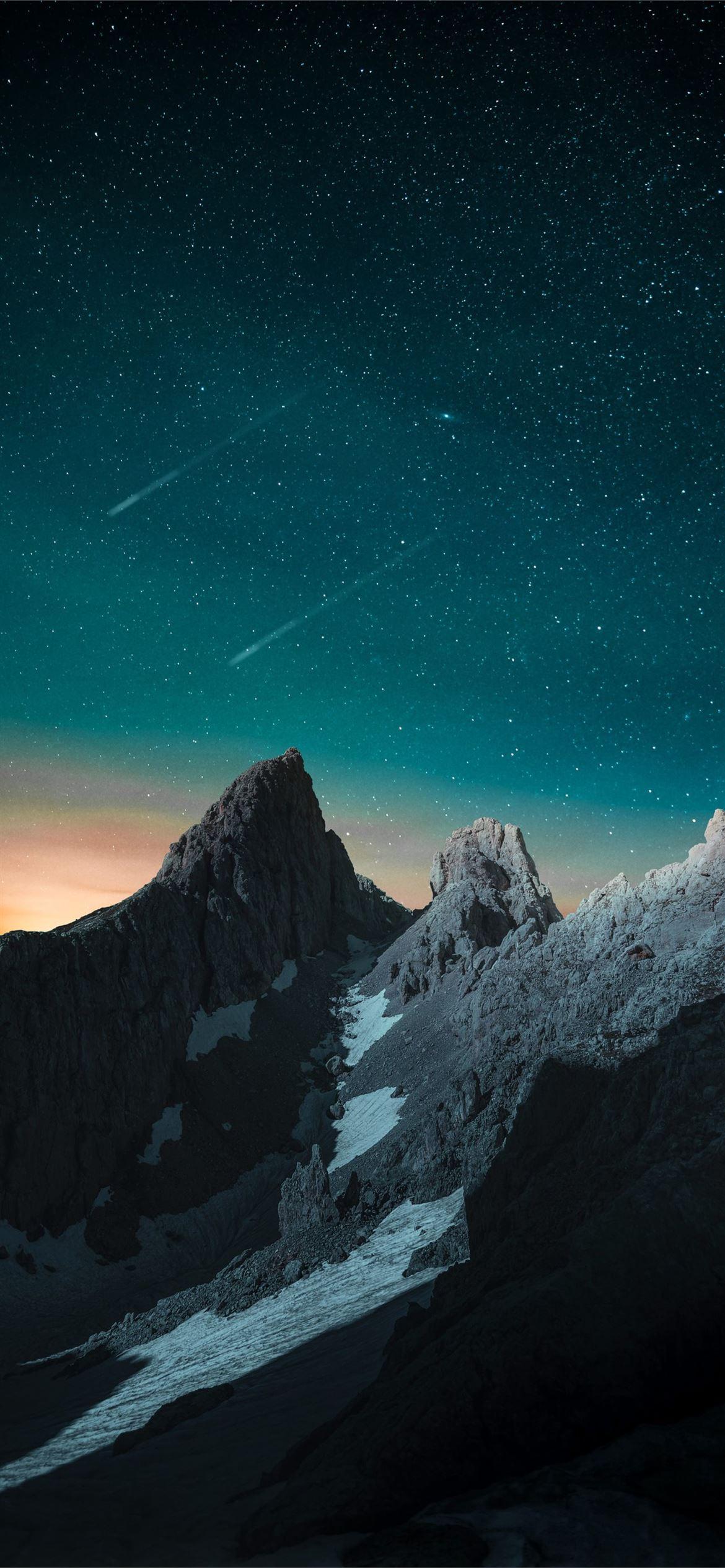 1170x2532 vibrant evening sky rocks mountains 4k iPhone Wallpaper Free Download