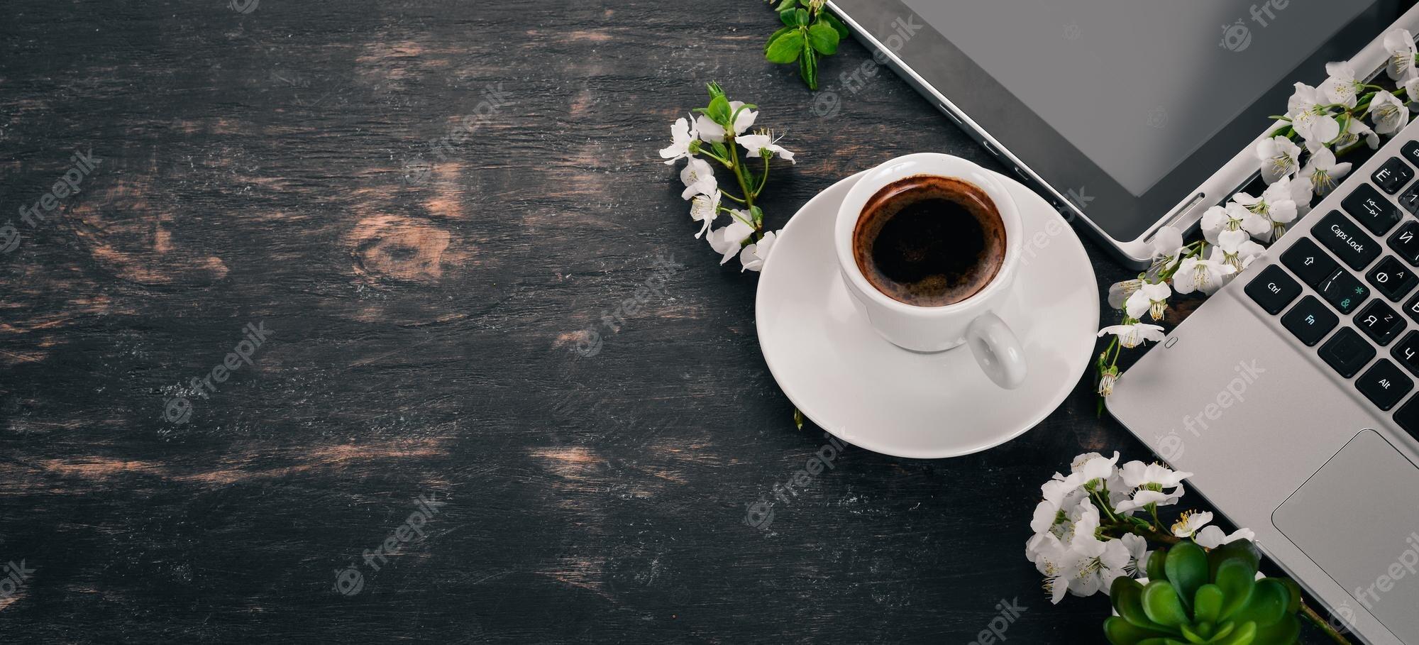 2000x909 Premium Photo. Laptop with coffee and flowers business on a wooden background top view copy space