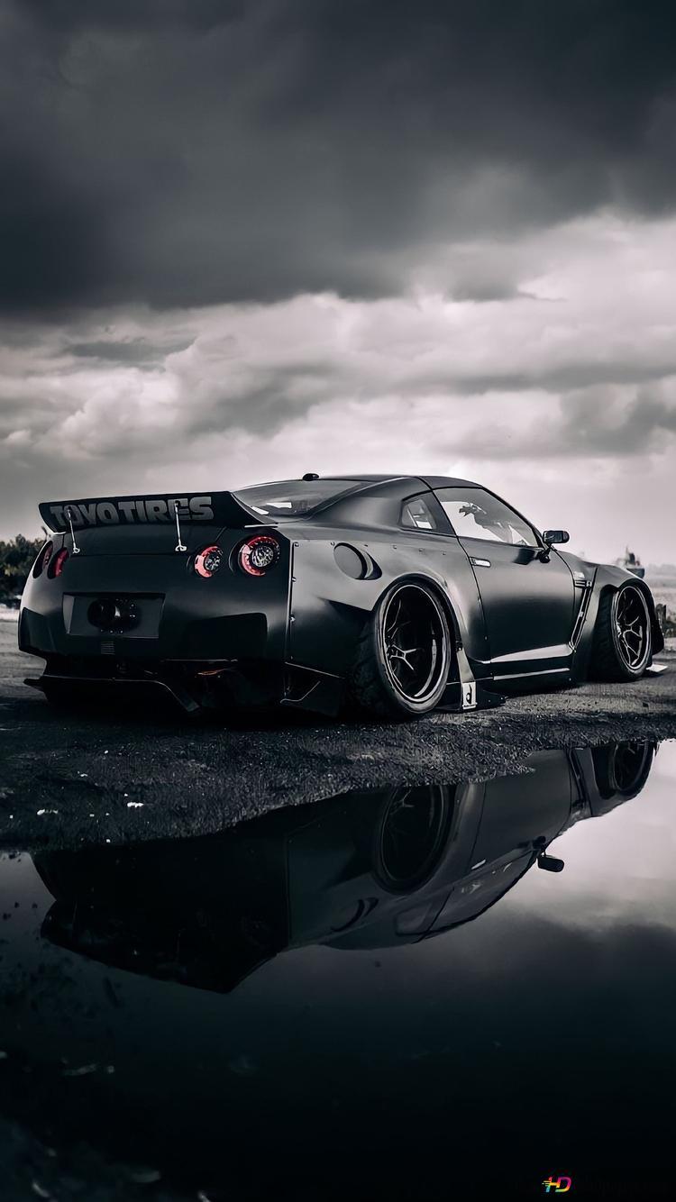 750x1334 Cool black glossy color Nissan reflecting in water on asphalt road in cloudy view outdoors HD wallpaper download