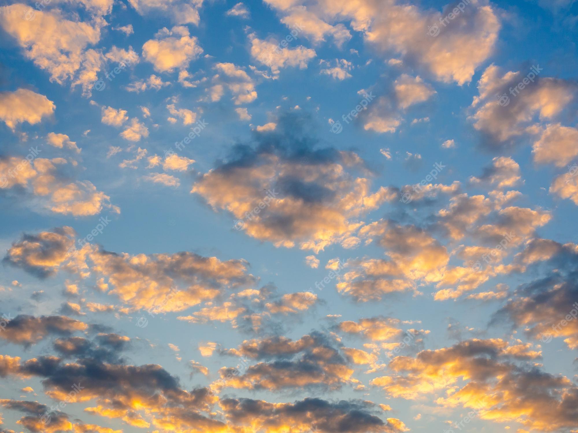 2000x1500 Premium Photo. Beautiful golden clouds on sunset sky background