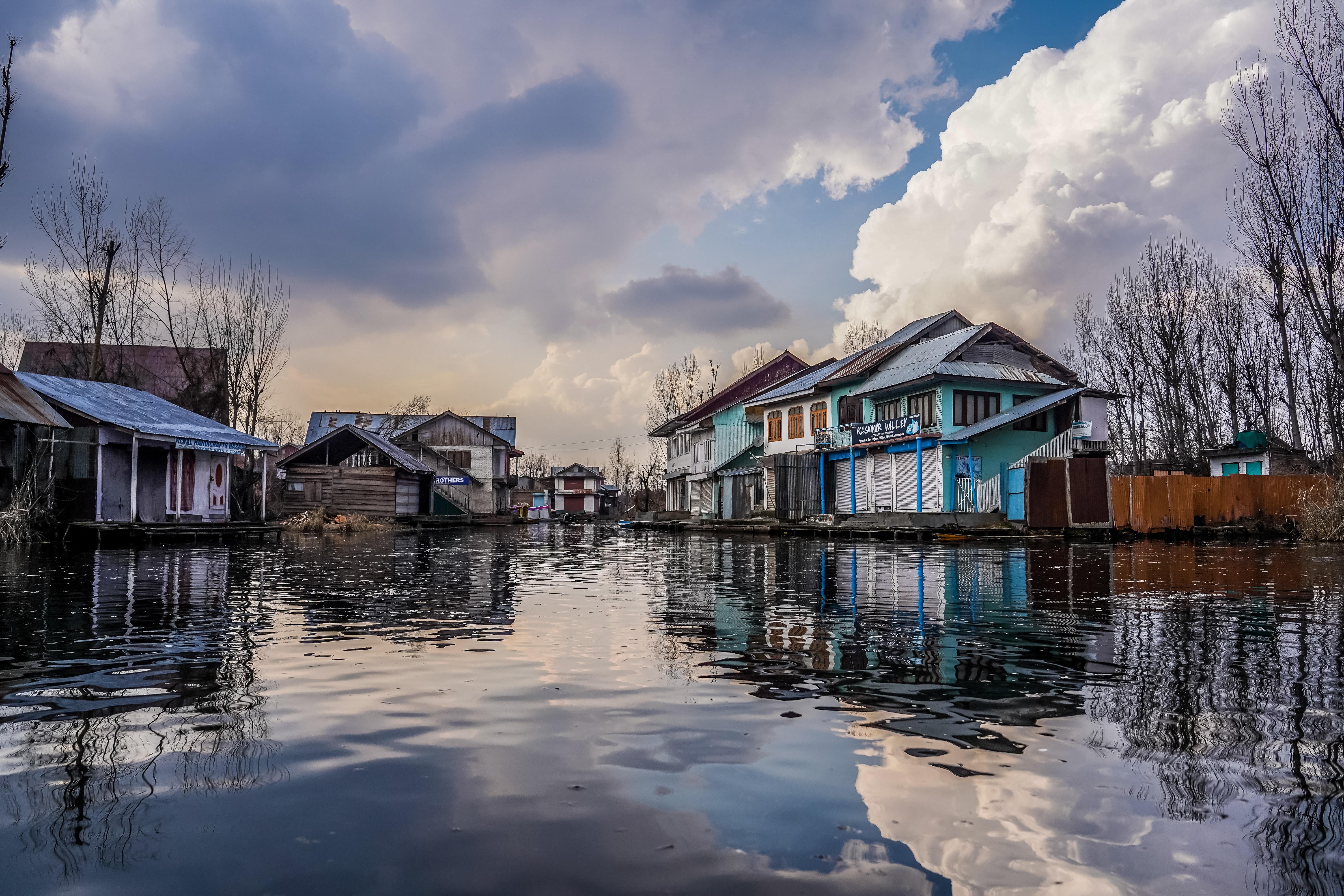 6000x4000 Blue and White Wooden Houses Beside River Under Blue and White Cloudy Sky · Free