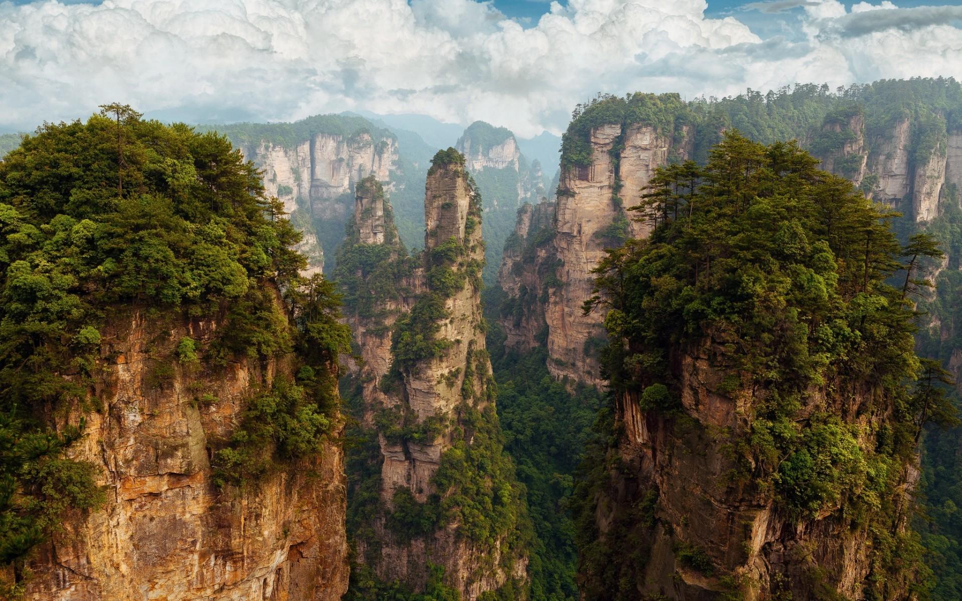 1920x1200 Zhangjiajie National Park, forest, clouds, nature, China, landscape, sky, sunset, Sun, mountains, trees, Hunan, rock formation Gallery HD Wallpaper