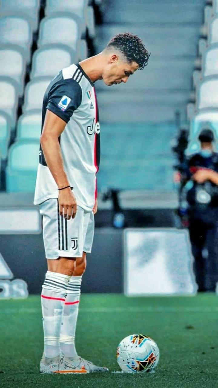720x1280 Download Cristiano Ronaldo Portugal Looking At Ball Wallpaper