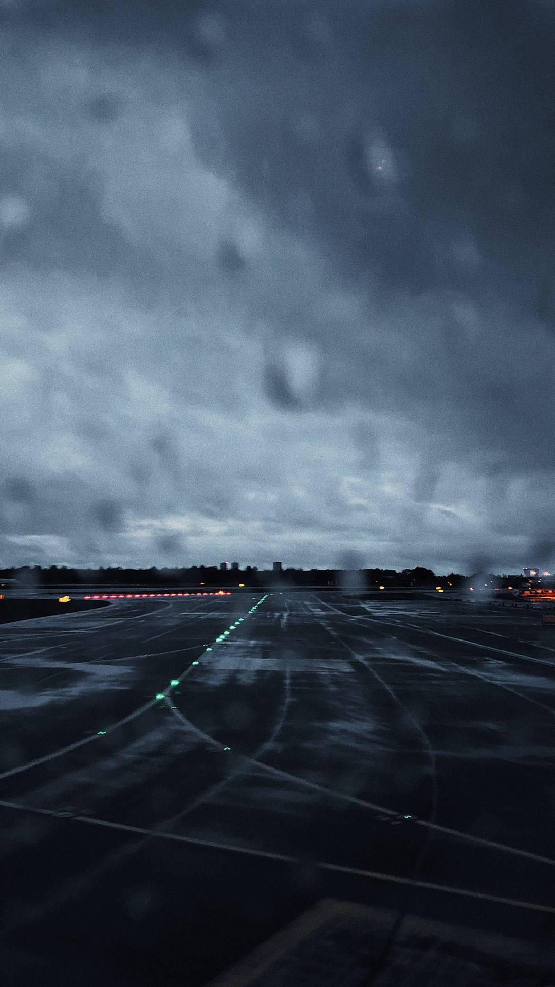 1080x1920 Download Rainy Day On The Runway Wallpaper