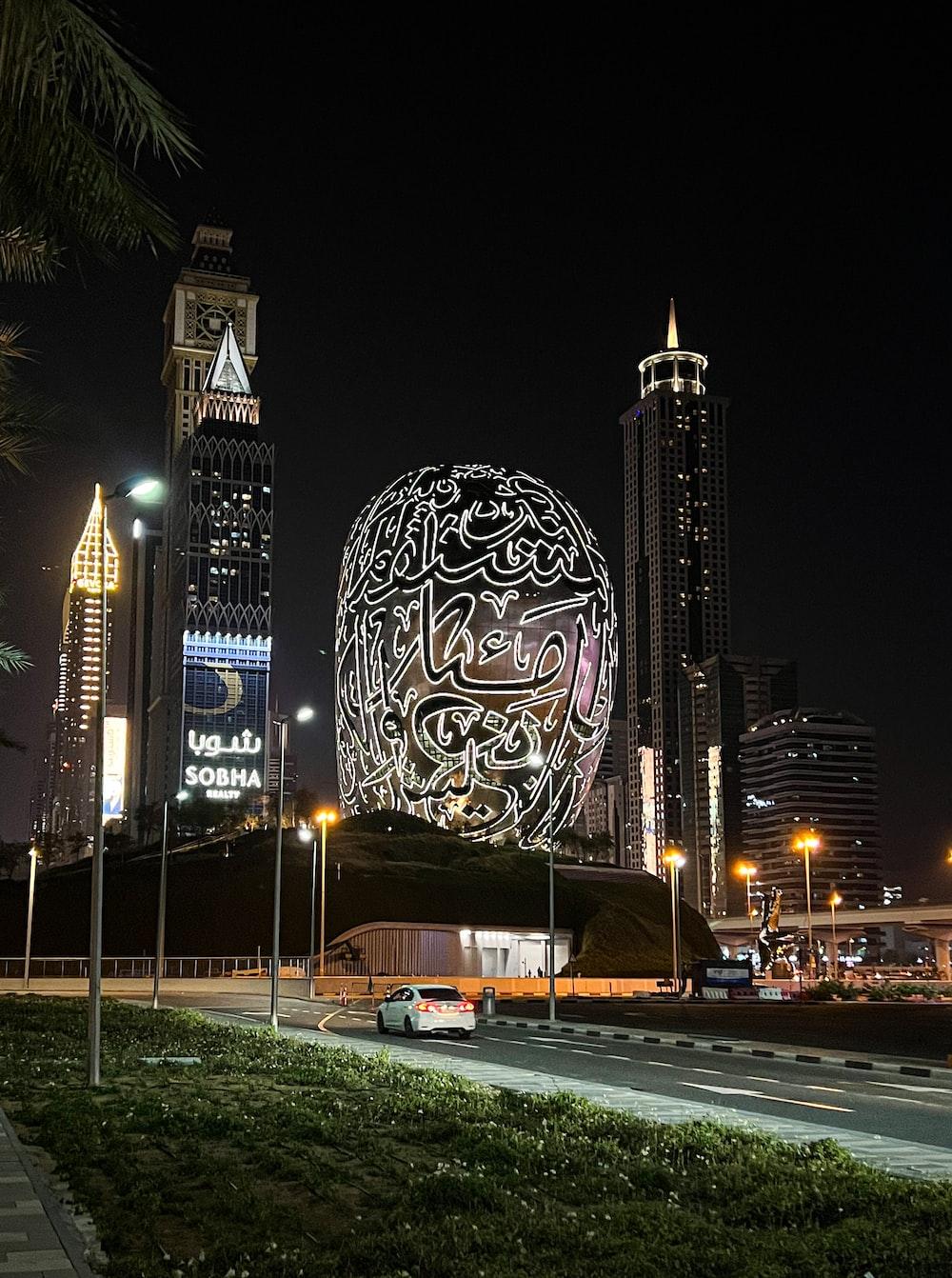 1000x1342 A building with a giant ball in the middle of a city photo