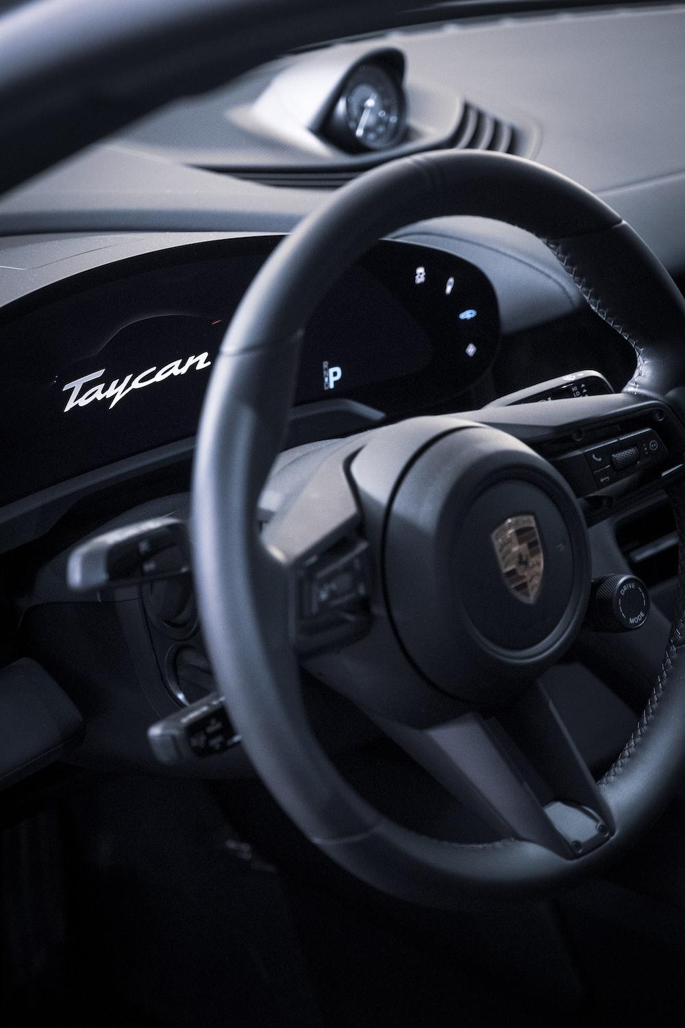 1000x1500 The steering wheel of a porsche car