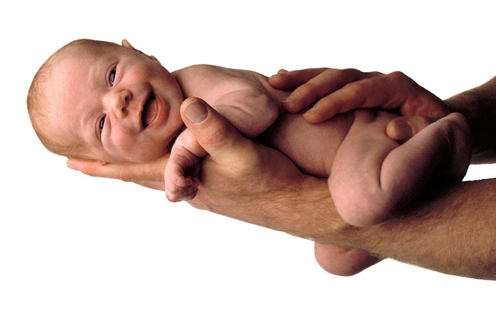 1600x1000 Newborn Baby Hand. dad holding his newborn child on his hand