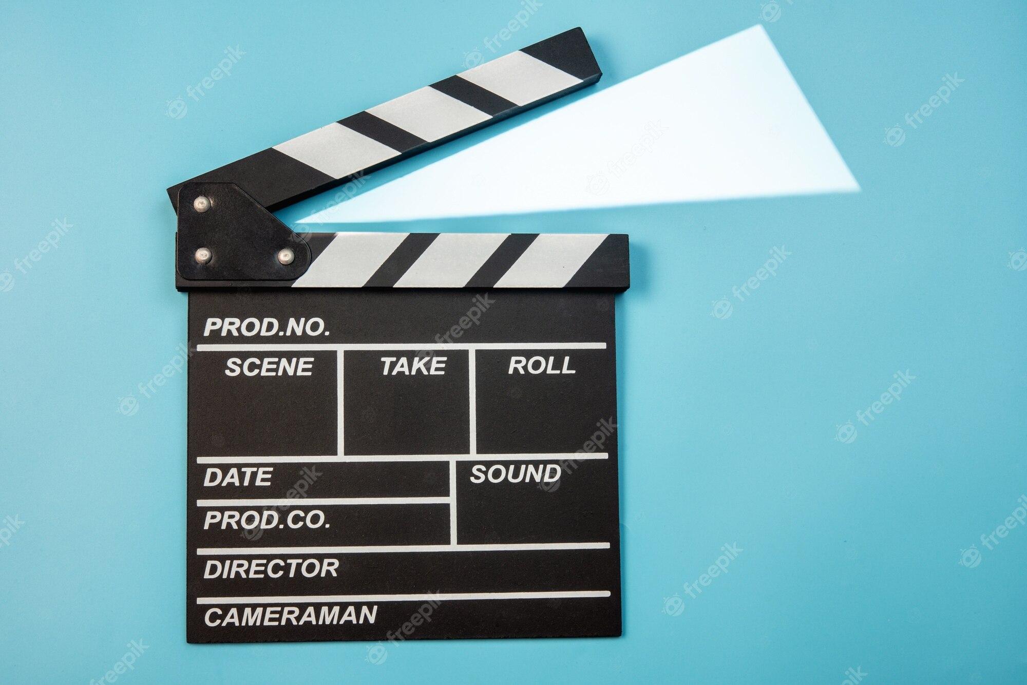 2000x1334 Premium Photo. Movie clapperboard on blue background
