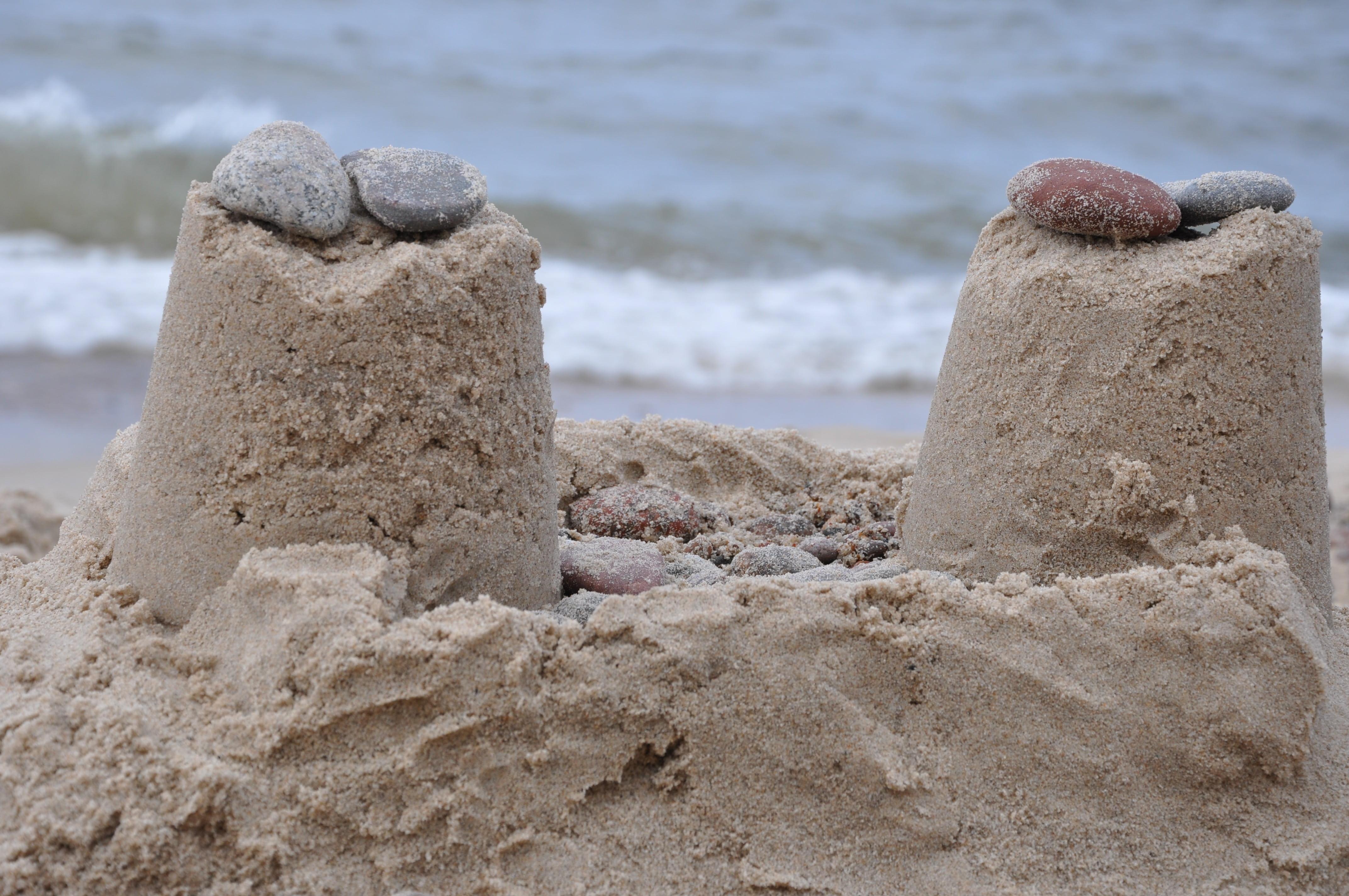 4288x2848 Wallpaper / outdoors, coastline, day, sunlight, sand, beach, concrete, sea, stone, sandcastle, art and craft, creativity, rock, land, pebbles, nature, focus on foreground free download