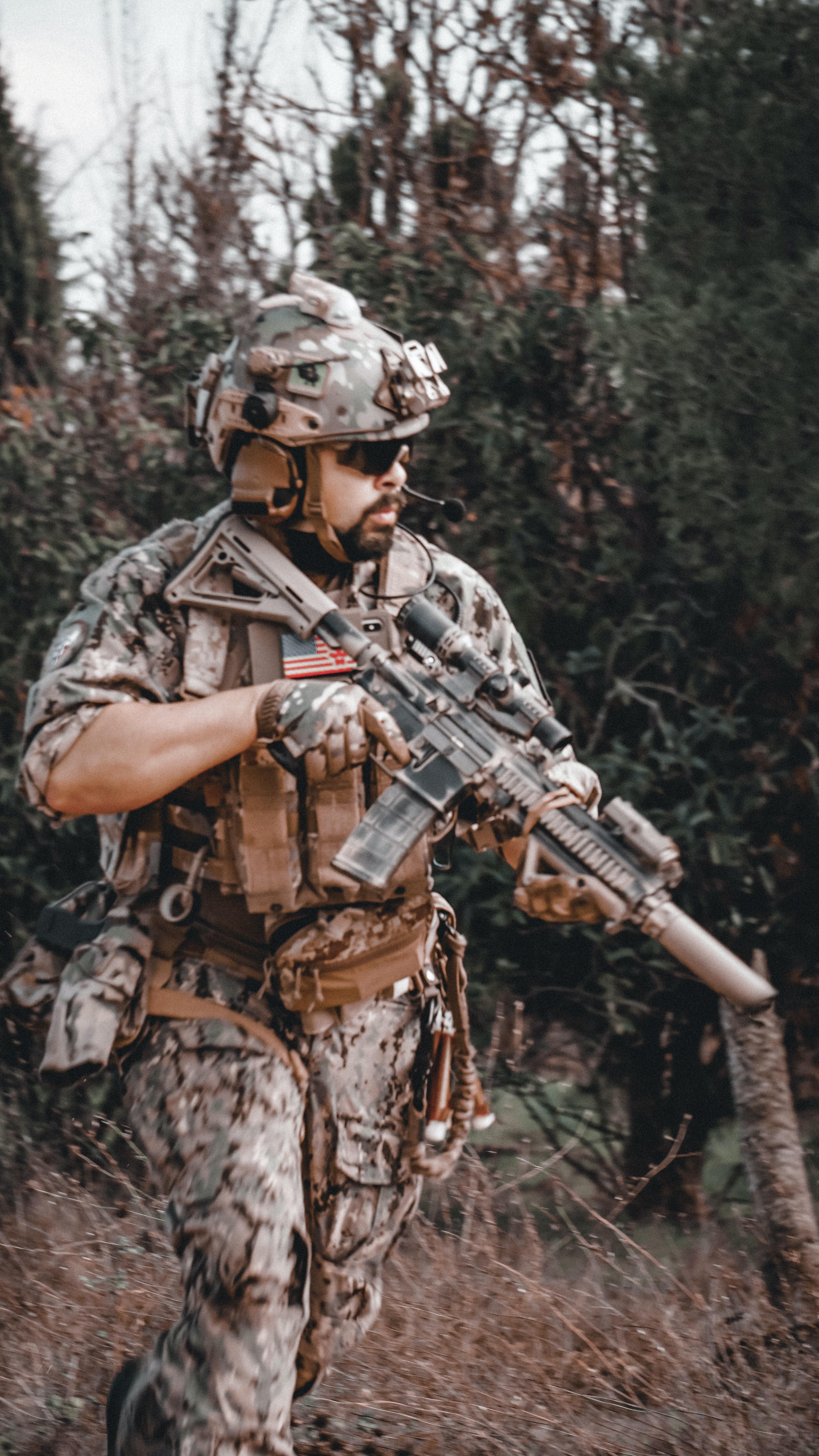 3376x6000 Man Carrying a Rifle · Free